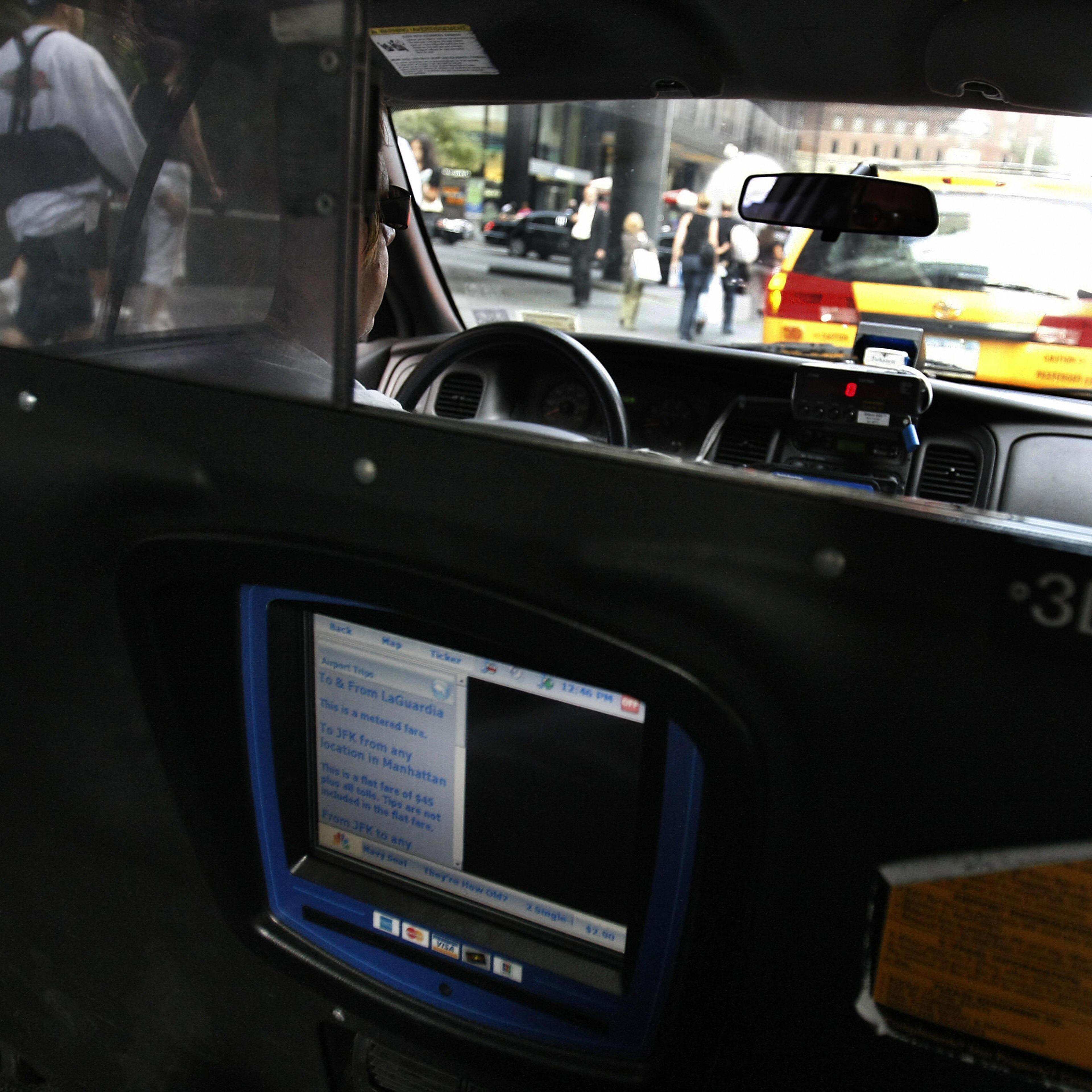 A New York City cab driver waits in line