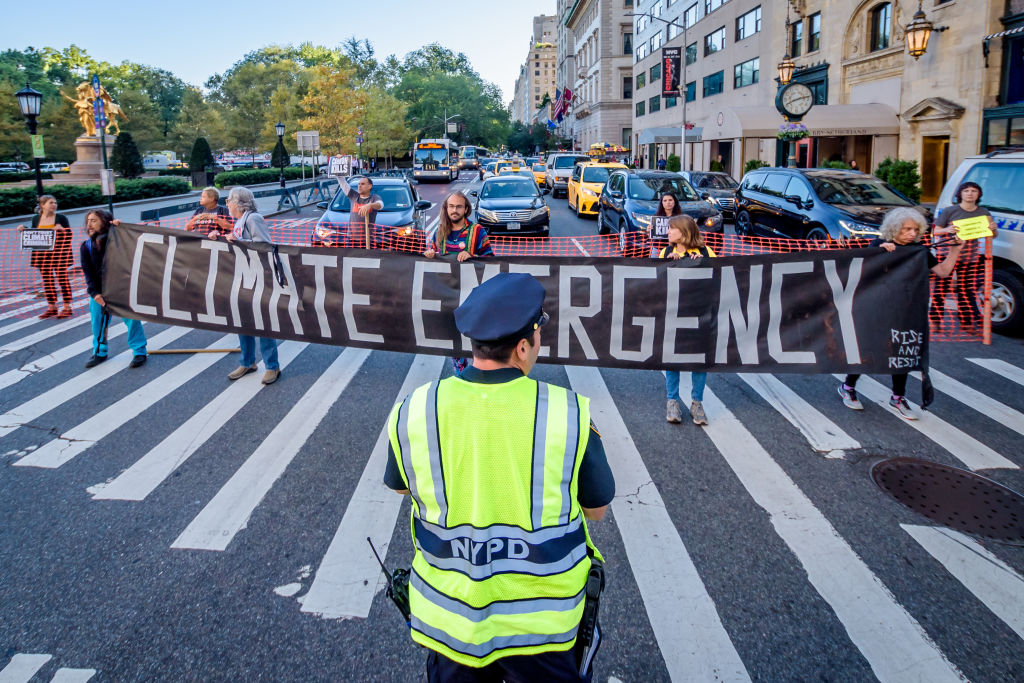 Protesters used banners to block a traffic intersection.
