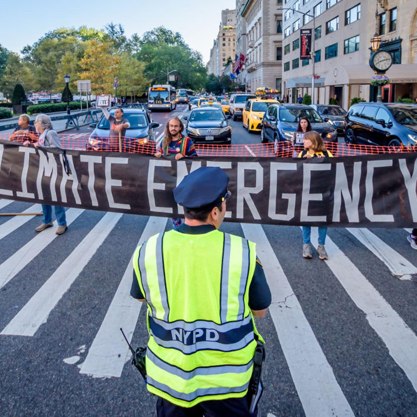 Protesters used banners to block a traffic intersection.