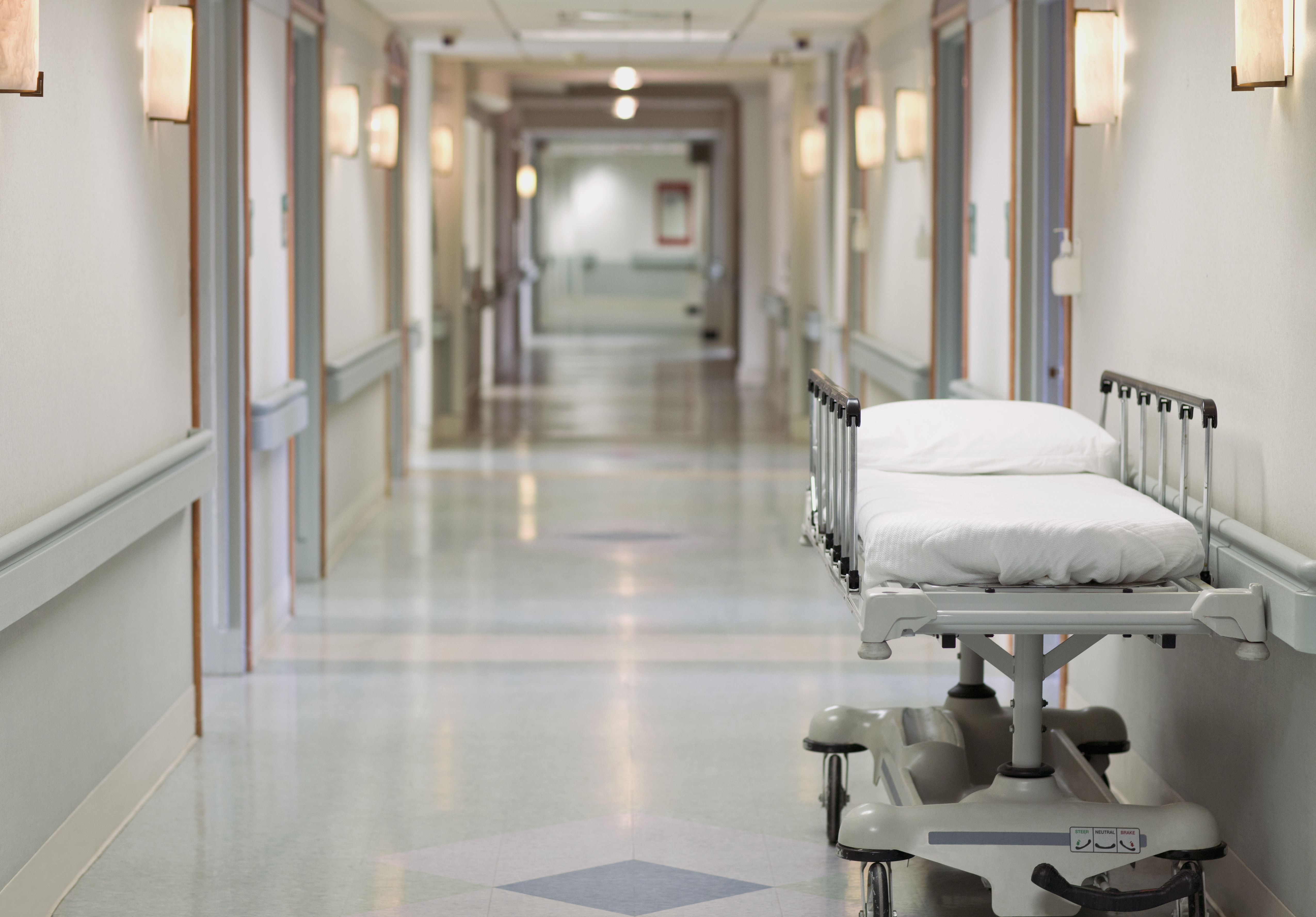 Portable hospital bed in hallway