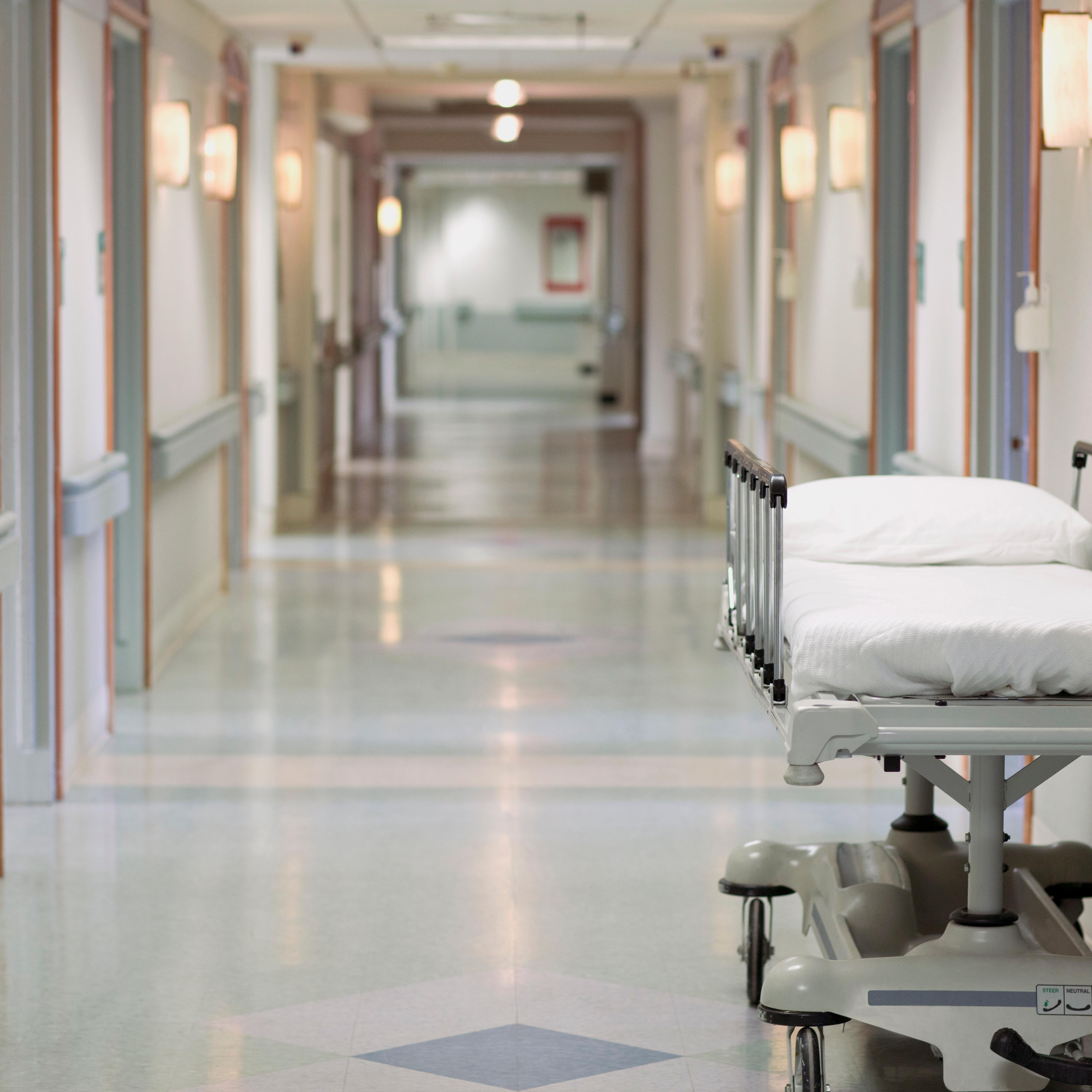 Portable hospital bed in hallway
