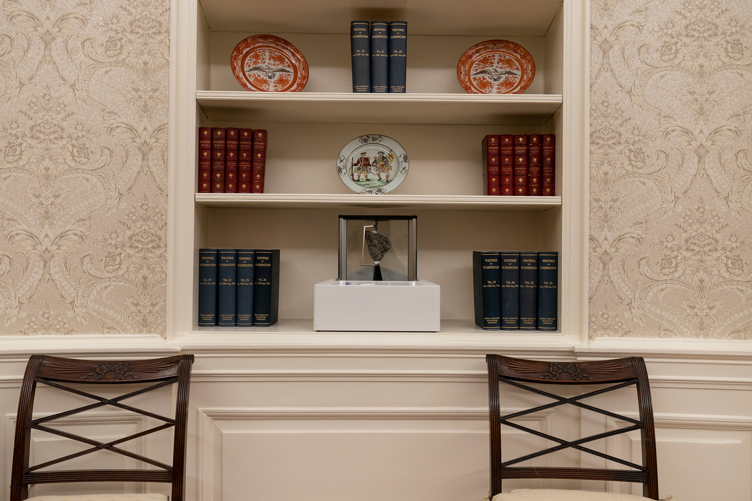The Oval Office of the White House is newly redecorated for the first day of President Joe Biden's administration, on Jan. 20, including a rock from the moon on the center shelf
