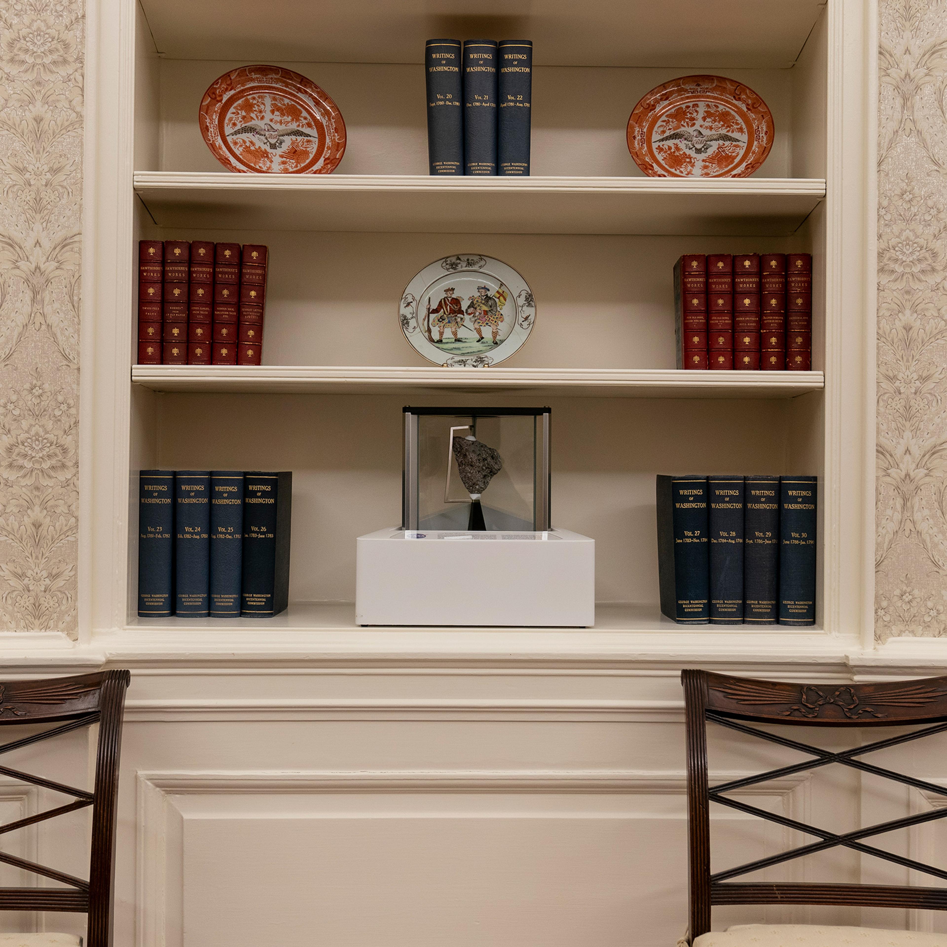 The Oval Office of the White House is newly redecorated for the first day of President Joe Biden's administration, on Jan. 20, including a rock from the moon on the center shelf