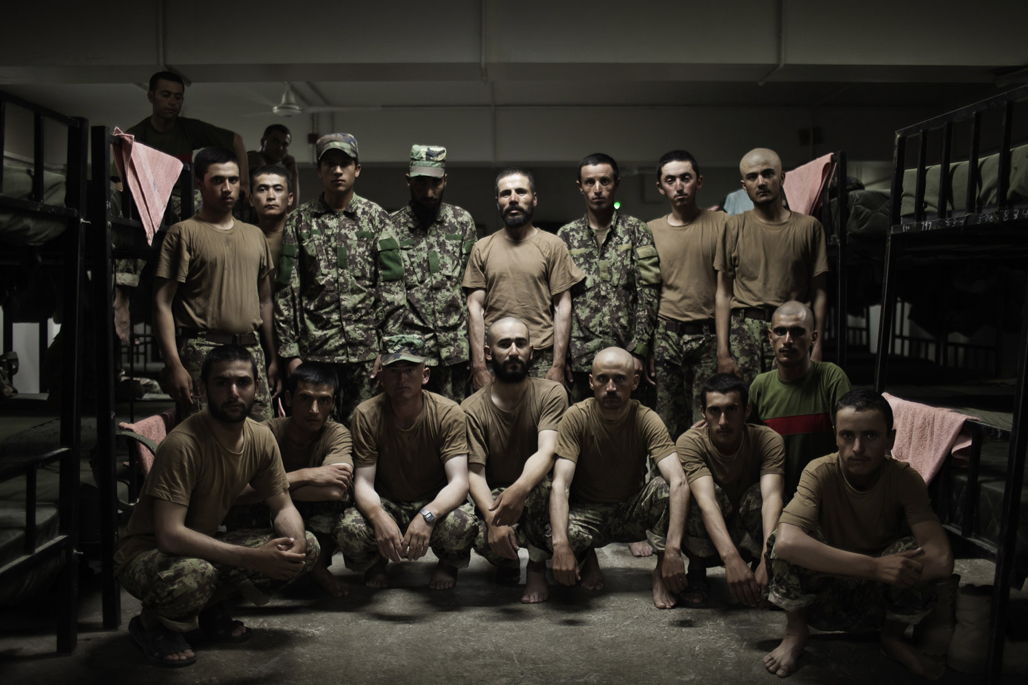 Afghan soldiers from 5th Company, Kandak 166 Training Battalion, Afghan National Army stand for a portrait in a barrack at the Kabul Military Training Centre in Afghanistan on Aug. 22 2011.