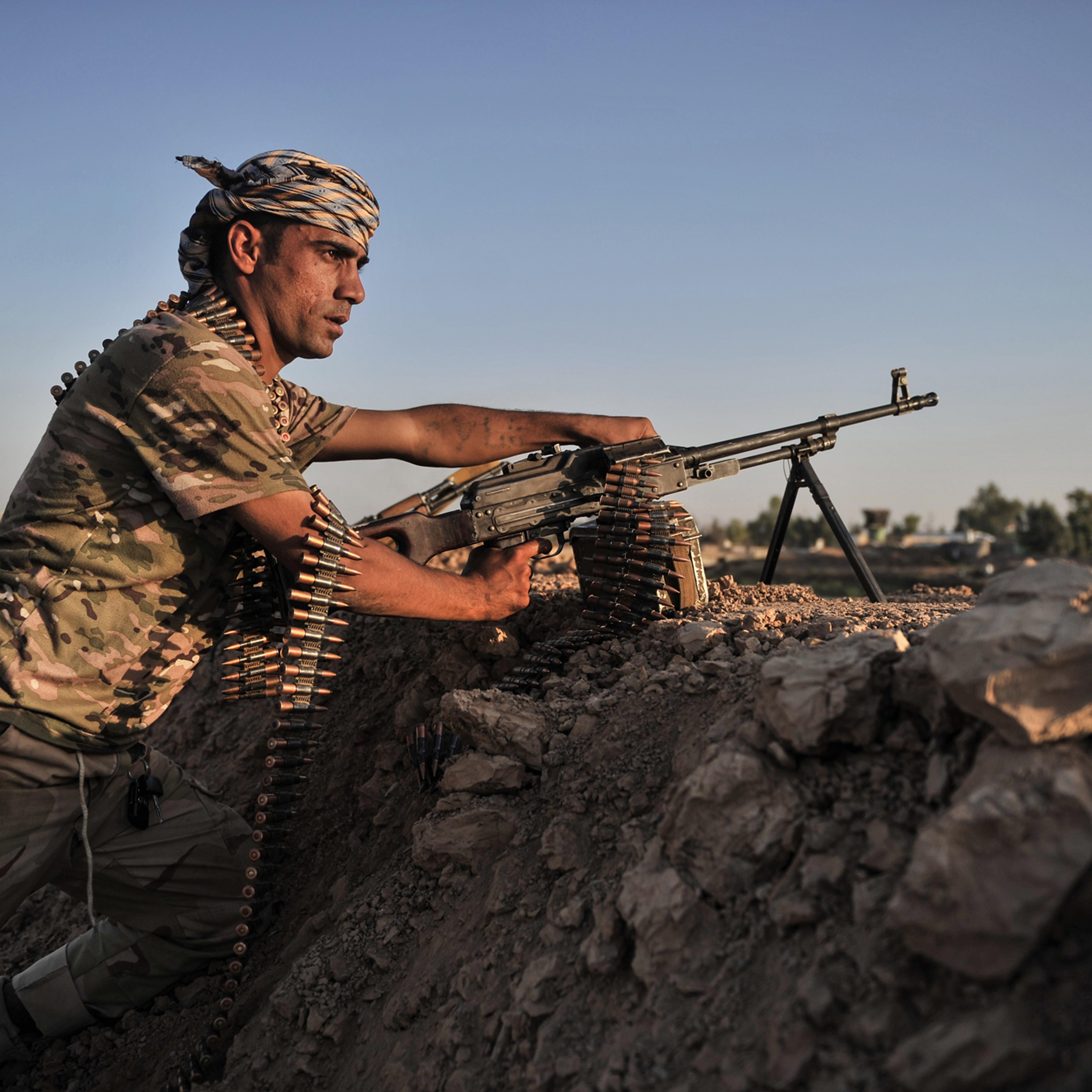 Kurdish Peshmerga forces stand guard in the oil-rich city of Kirkuk against Islamic State of Iraq and Syria (ISIS) on June 17, 2014.