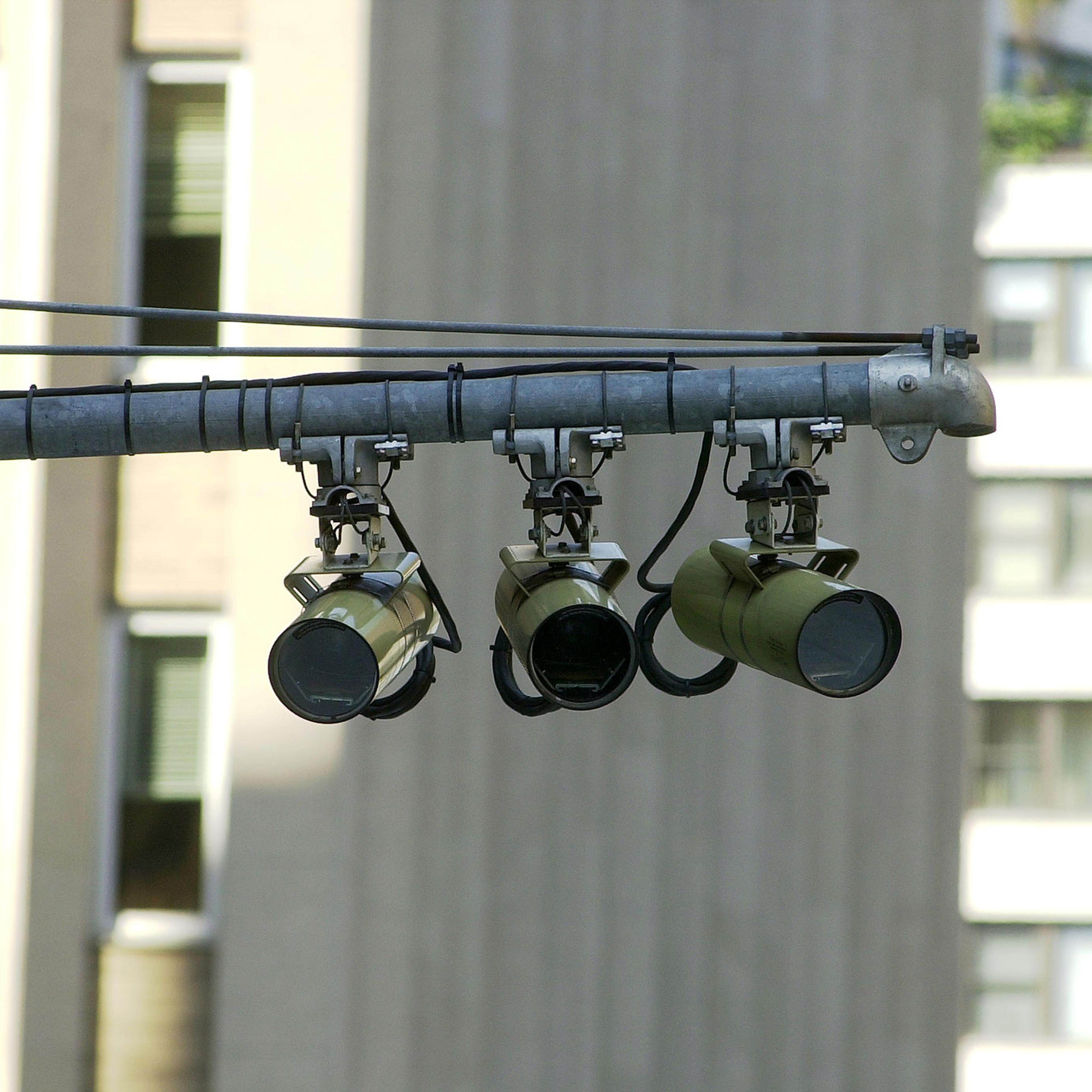 Red-light cameras monitor the traffic at the corner of Secon