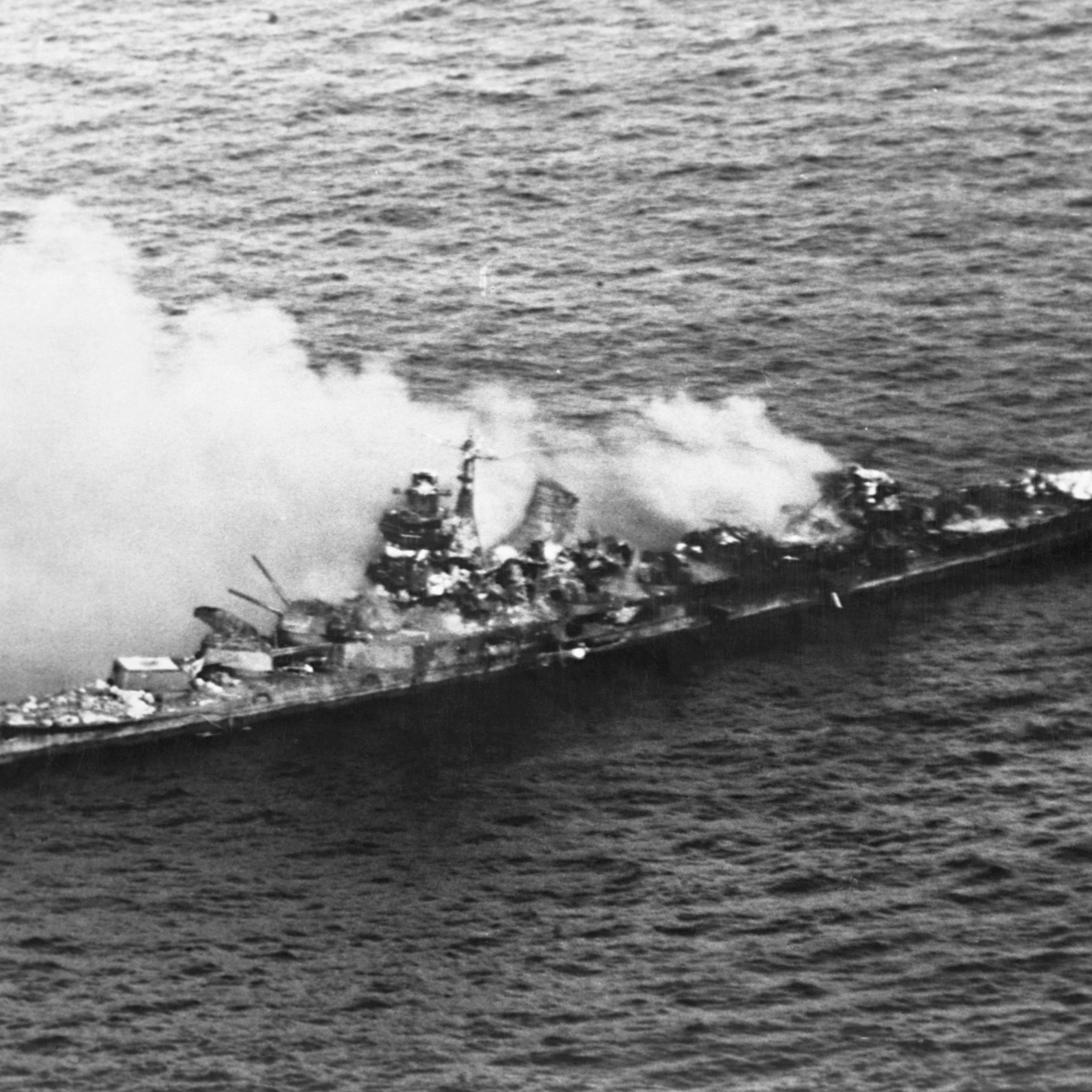 A Japanese Mogani class cruiser burns after being bombed in the Battle of Midway in June 1942.