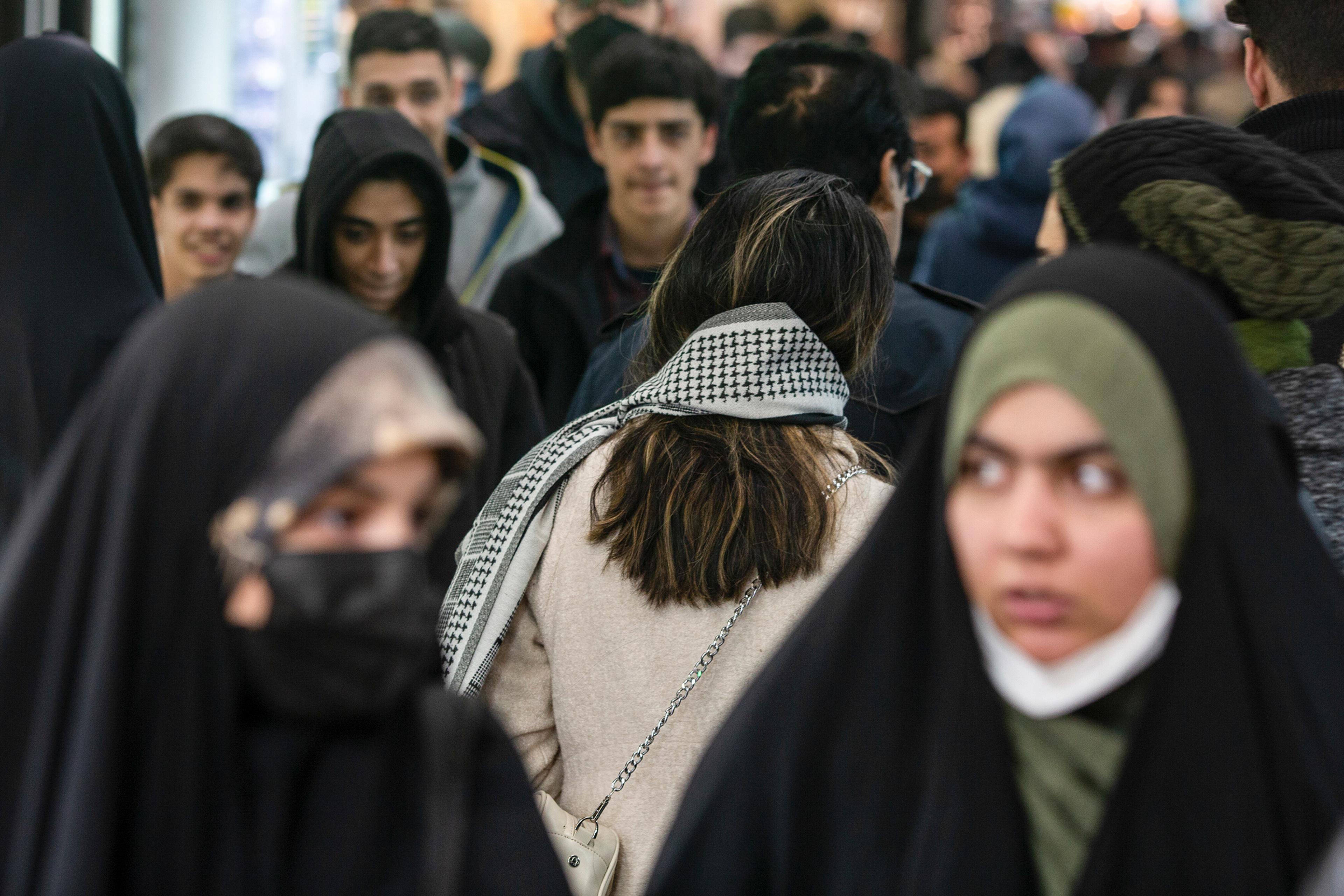 A woman, sans-head covering, at the Tajrish Bazaar in Tehran on Jan. 28. Defiant resistance to Iran's mandatory hijab law has spread across the country after nationwide protests that erupted last year.