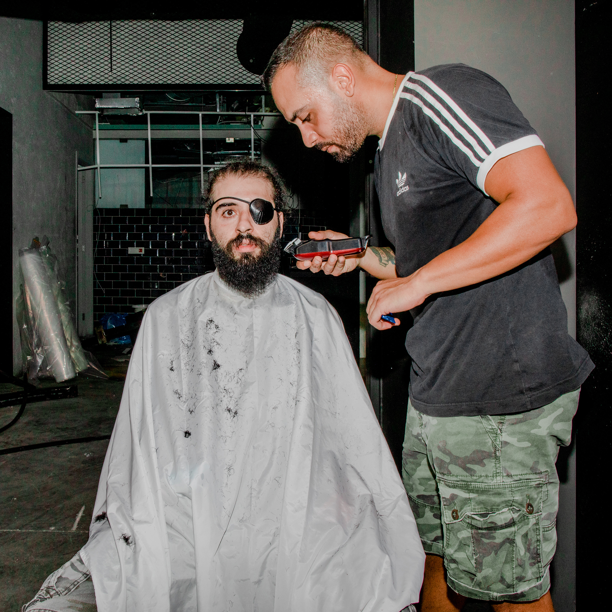 Kevin Obeid cuts Jad Estephan’s hair in the Mar Mikhael area of Beirut on Aug. 7, three days after the deadly port explosion. "Let us hope that this catastrophe doesn't destroy us even further," says Estephan, who lost his eye at the beginning of the rev
