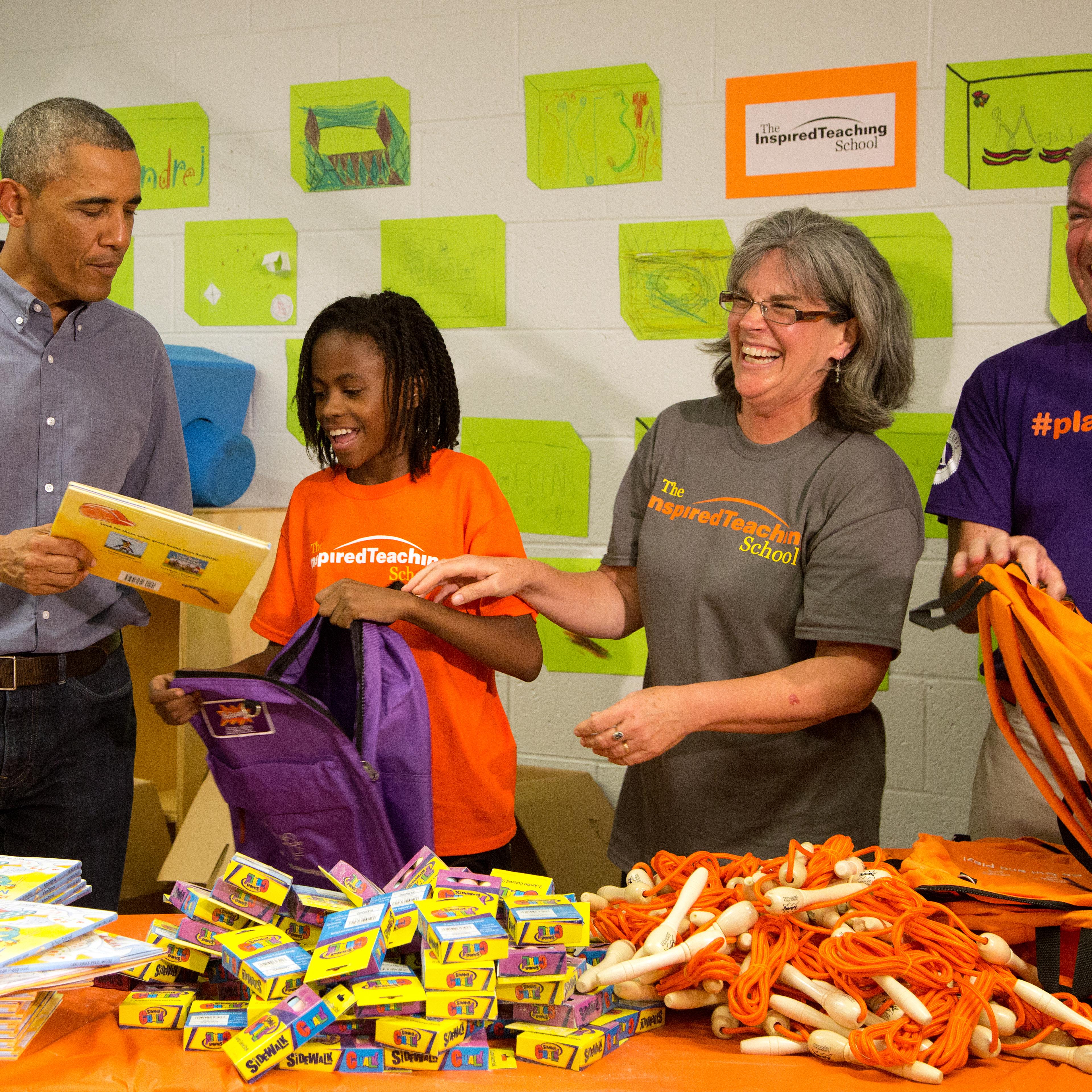 President Barack Obama and volunteers take part in a service project at the Inspired Teaching School in Washington, D.C. on September 11, 2014.