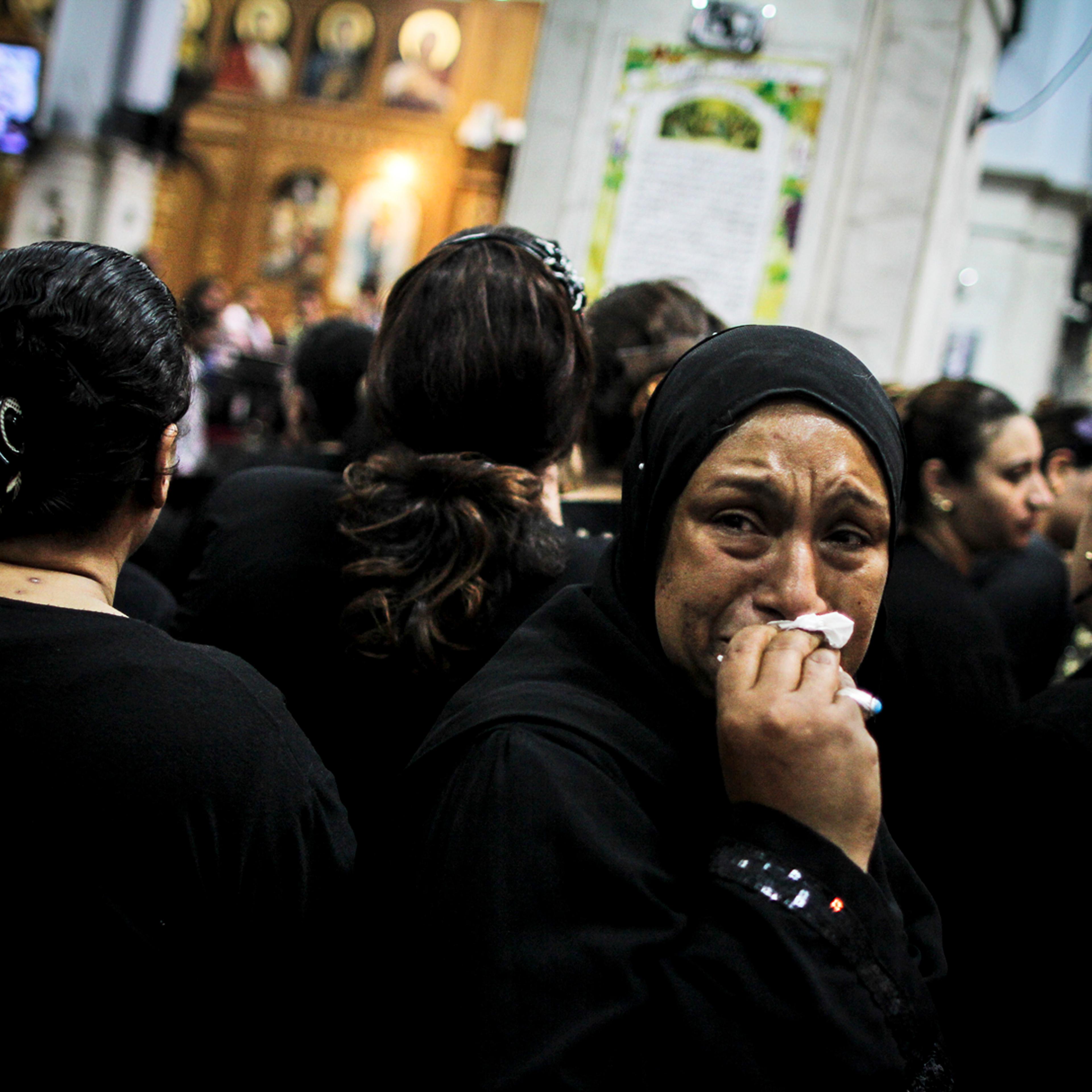 A mourner at the funeral of four Egyptian Christians killed in a drive-by shooting