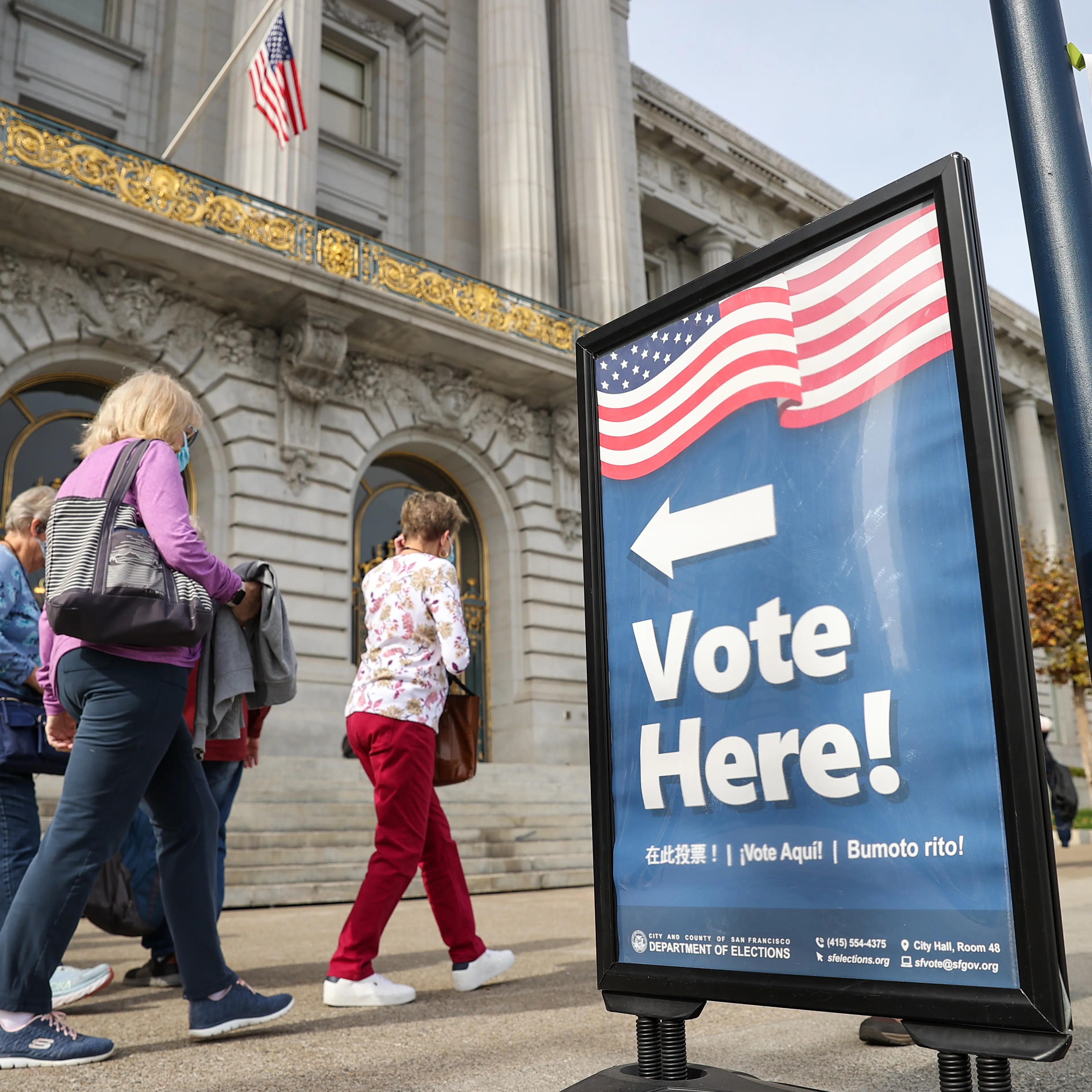 A sign in San Francisco on Oct. 28 directs people to an early voting station for the midterm elections.