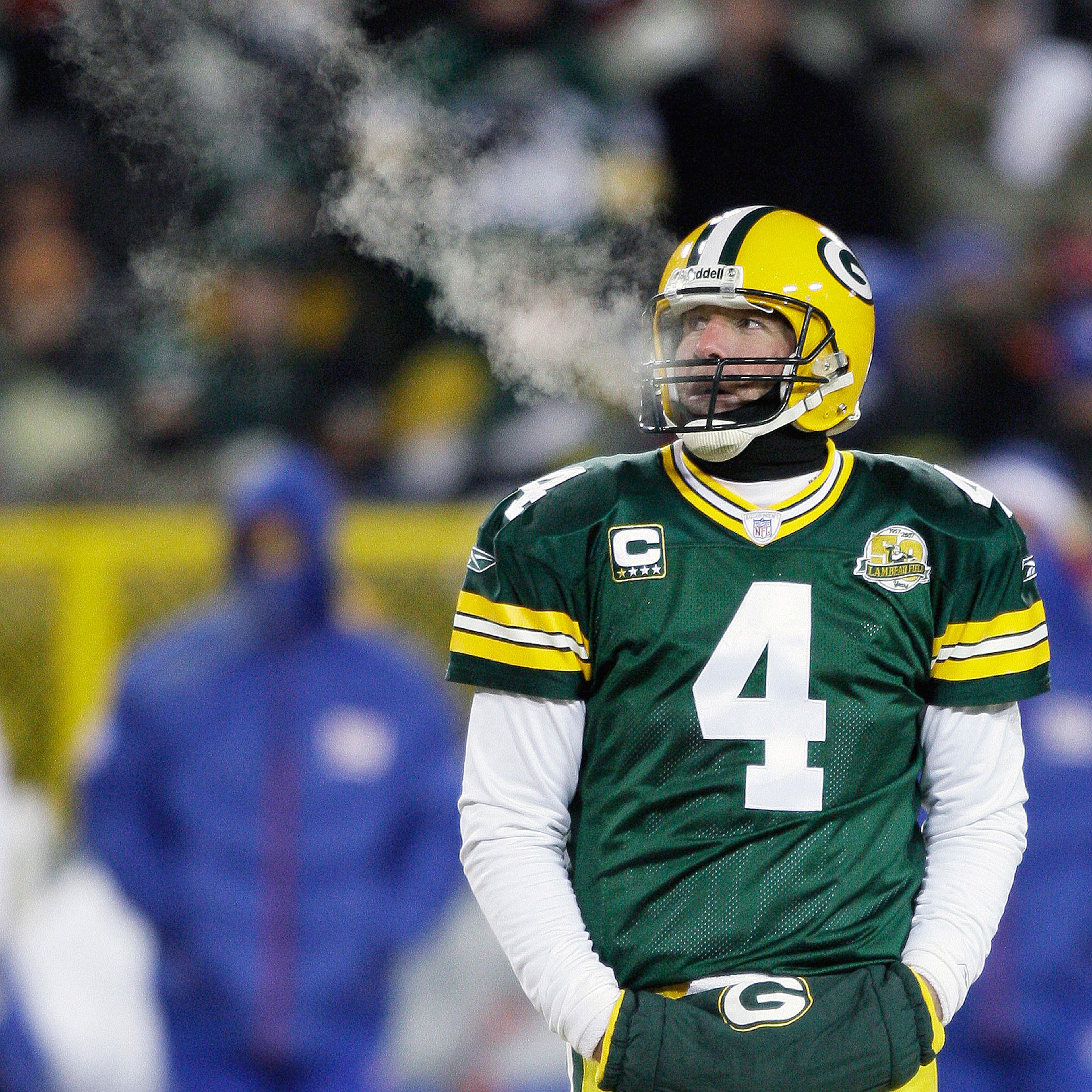 Temperature: -4°F (Wind Chill: -24°F). On Jan. 20, 2008, the Green Bay Packers faced the New York Giants in a frigid NFC championship football game. Here, Packers quarterback Brett Favre warms his hands at Lambeau Field in Green Bay, Wis.