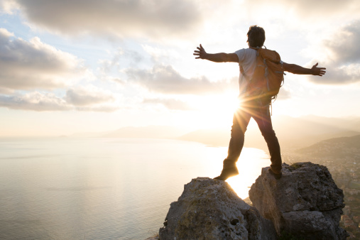 man-standing-between-summits