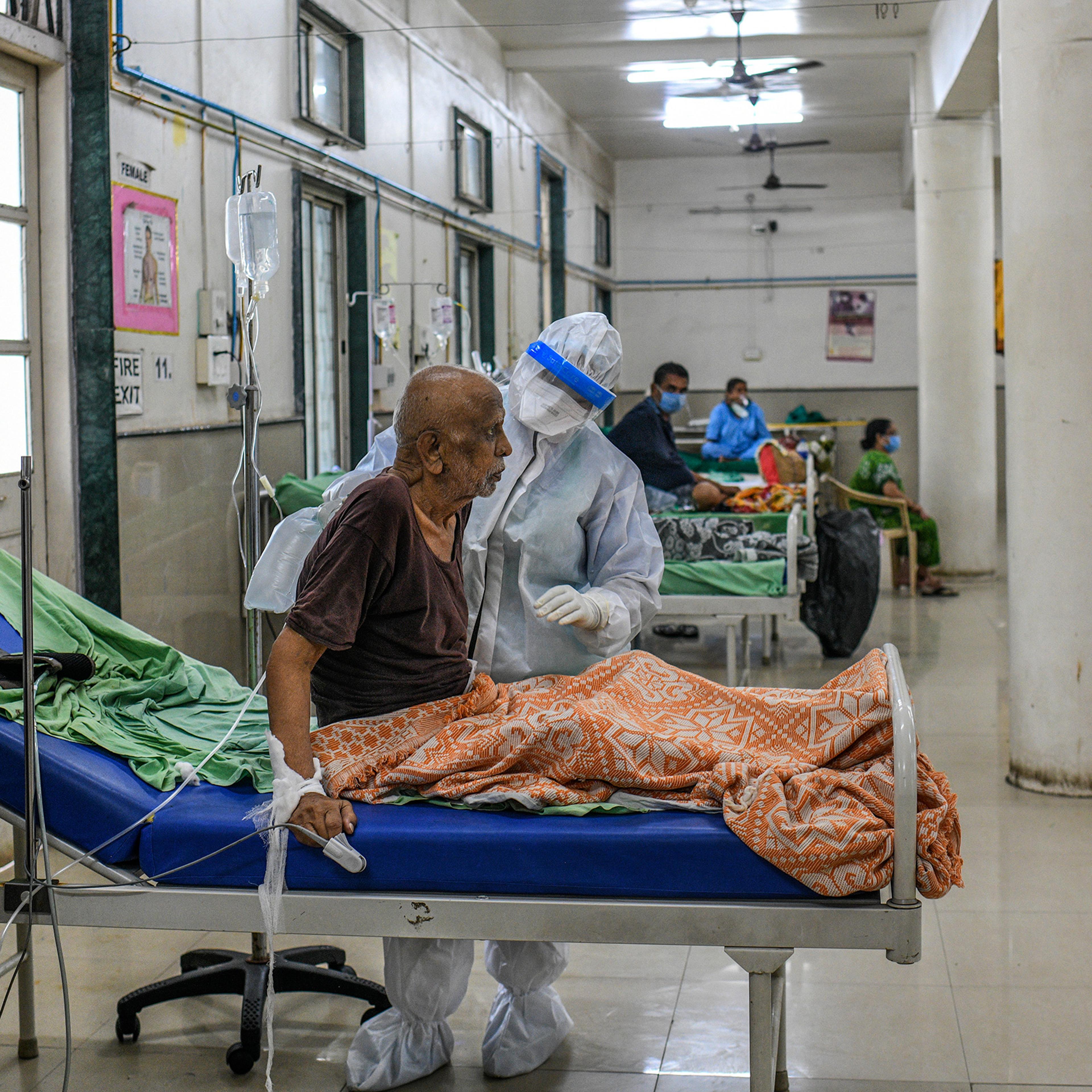 A nurse cares for a COVID-19 patient in the ICU at the Aundh District Hospital in Pune on Aug. 11.