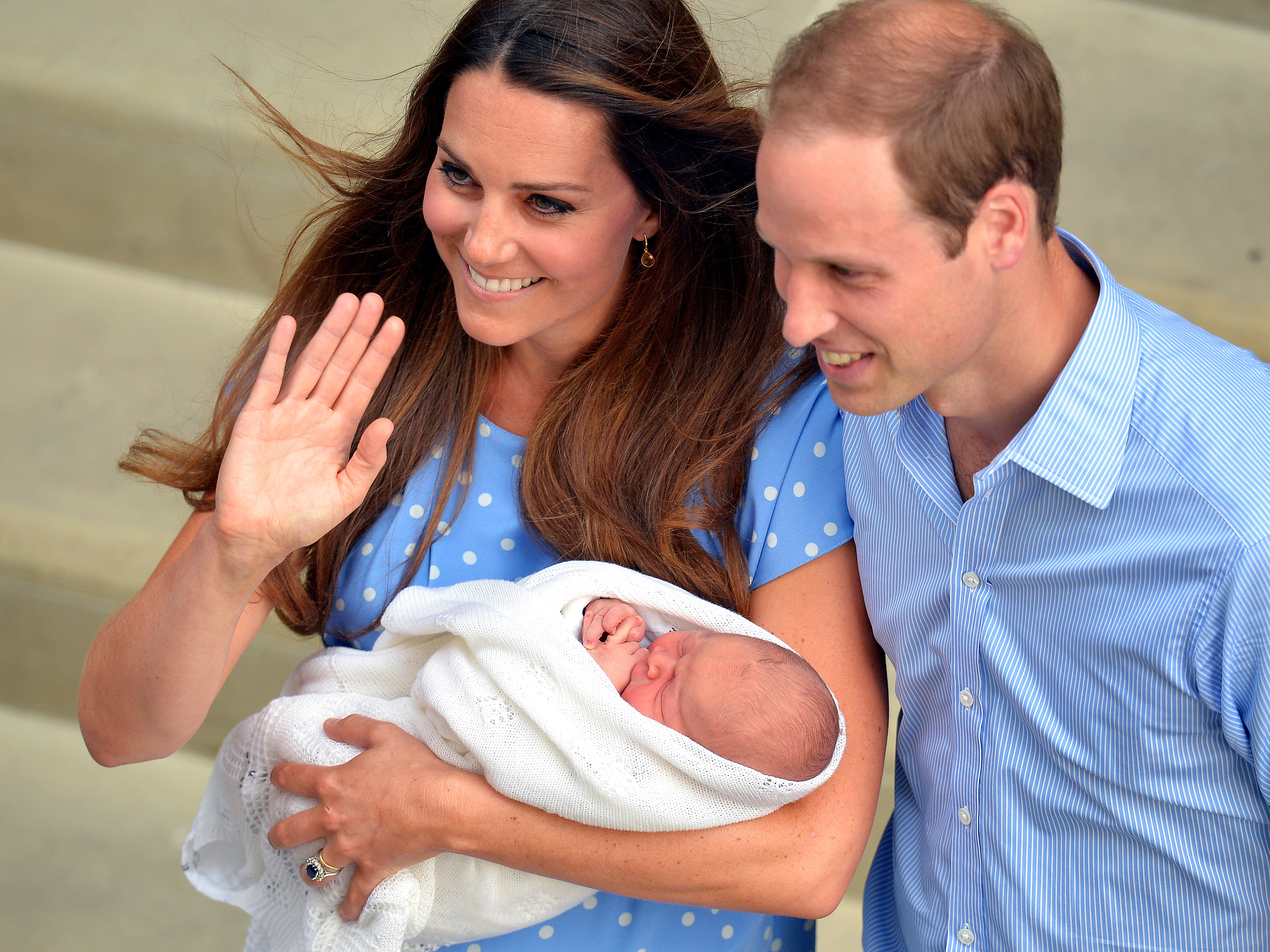 Prince William and Catherine, Duchess of Cambridge show their new-born baby boy to the world's media outside the Lindo Wing of St Mary's Hospital in London on July 23, 2013. The baby was born on Monday afternoon weighing eight pounds six ounces (3.8 kilo