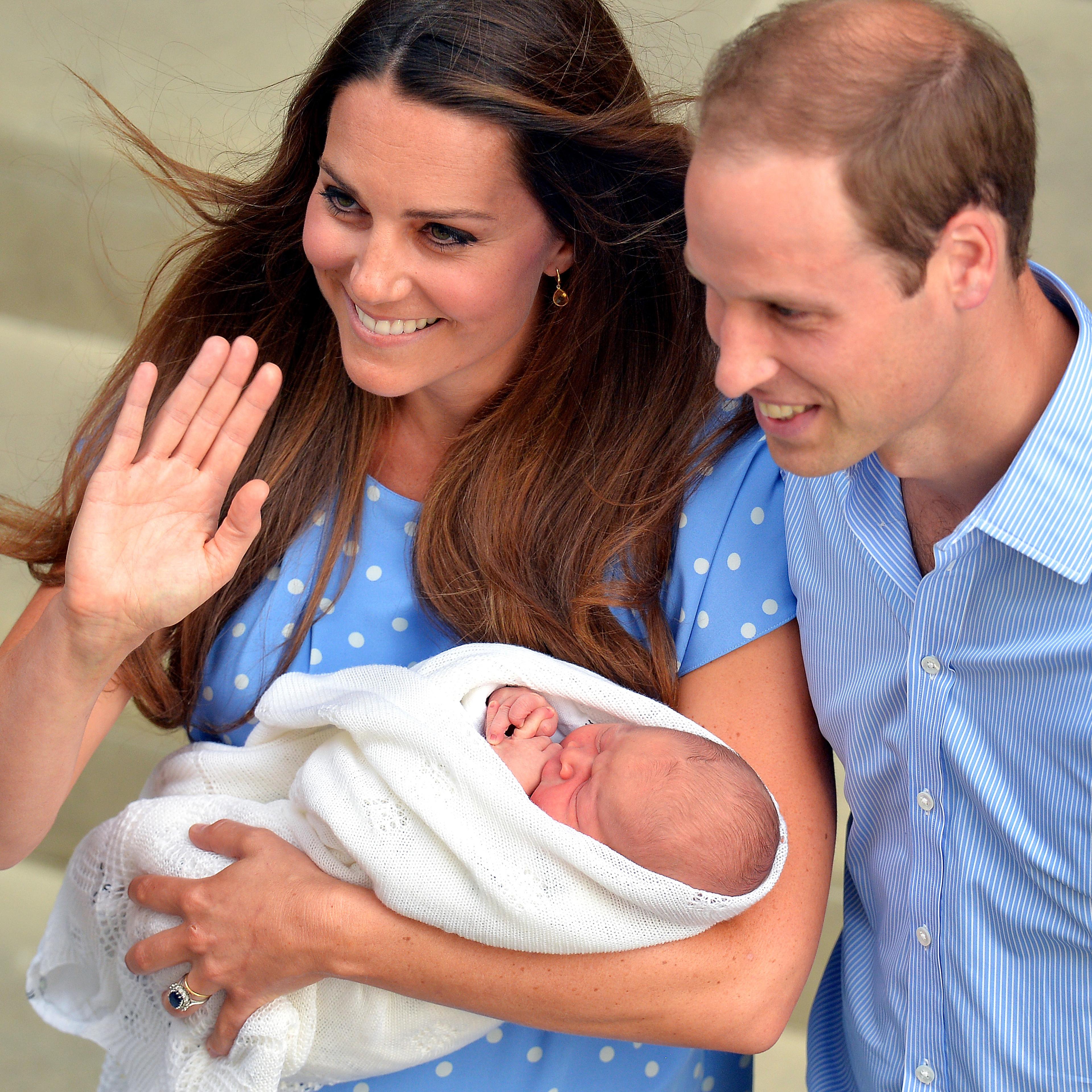 Prince William and Catherine, Duchess of Cambridge show their new-born baby boy to the world's media outside the Lindo Wing of St Mary's Hospital in London on July 23, 2013. The baby was born on Monday afternoon weighing eight pounds six ounces (3.8 kilo