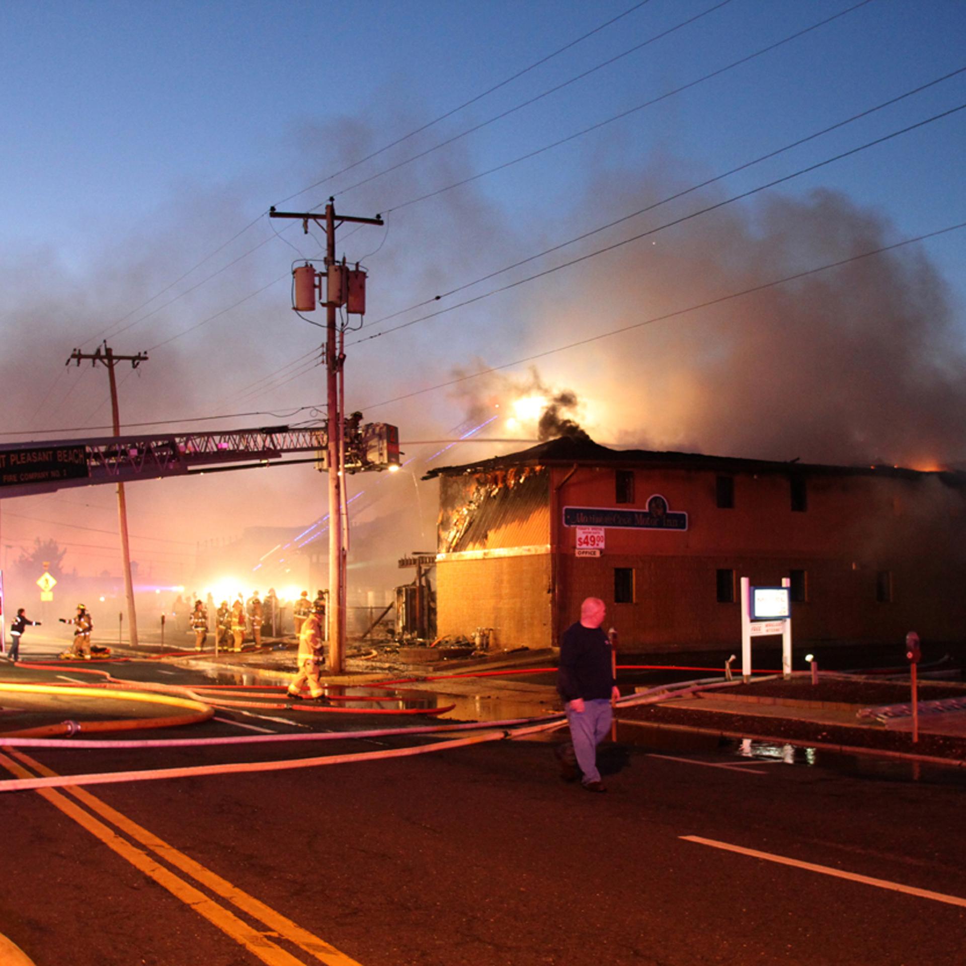 Firefighters work to put out a fire at Mariner's Cove Inn in Point Pleasant Beach, N.J., March 21, 2014.