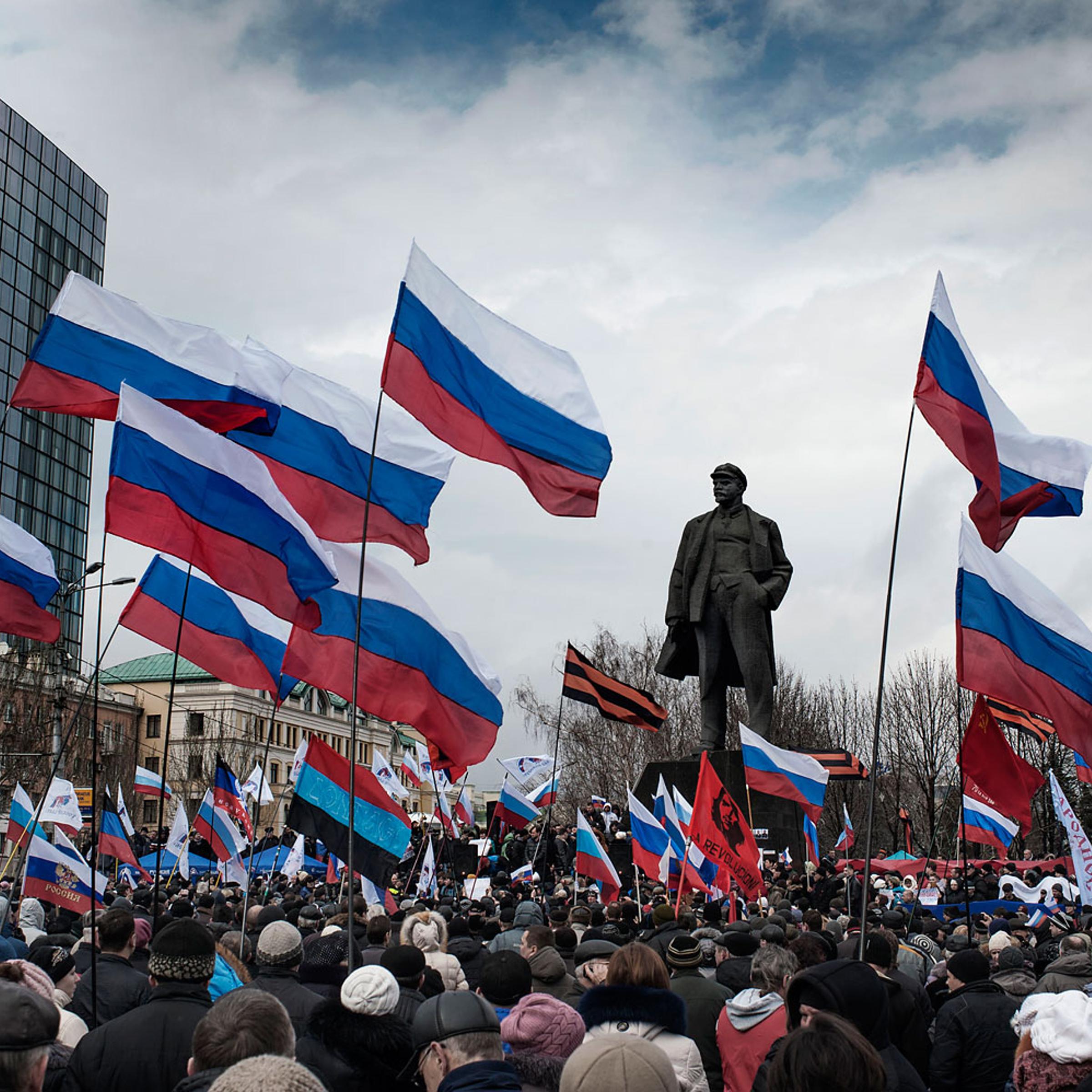 Pro-Russia supporters gather and wave Russian flags in Lenin Square in Donetsk, March 16, 2014.