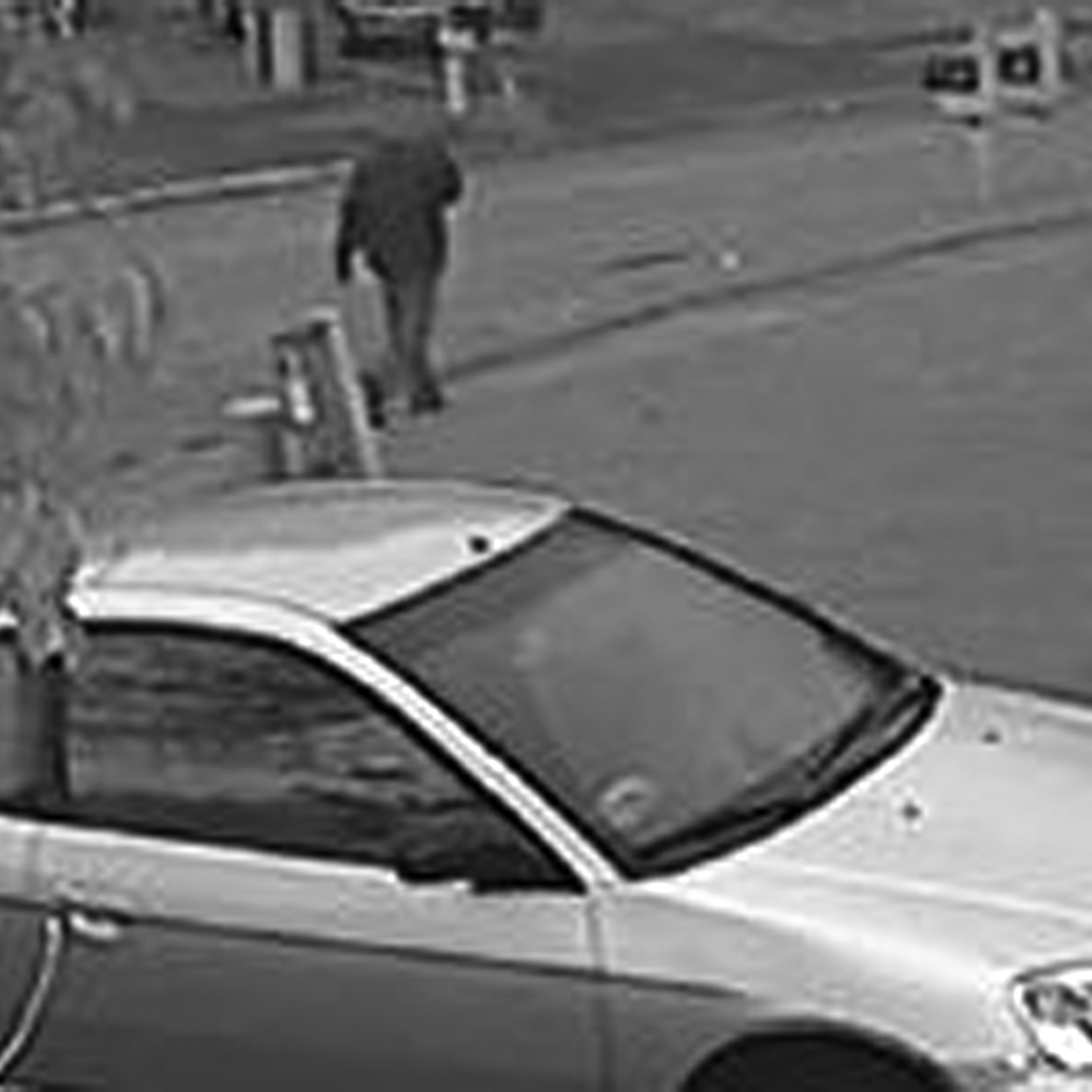 This frame grab from surveillance video provided by the Indianapolis Metropolitan Police Department shows a possible suspect walking in the neighborhood where an Indianapolis pastor's wife was shot on Nov. 10, 2015.