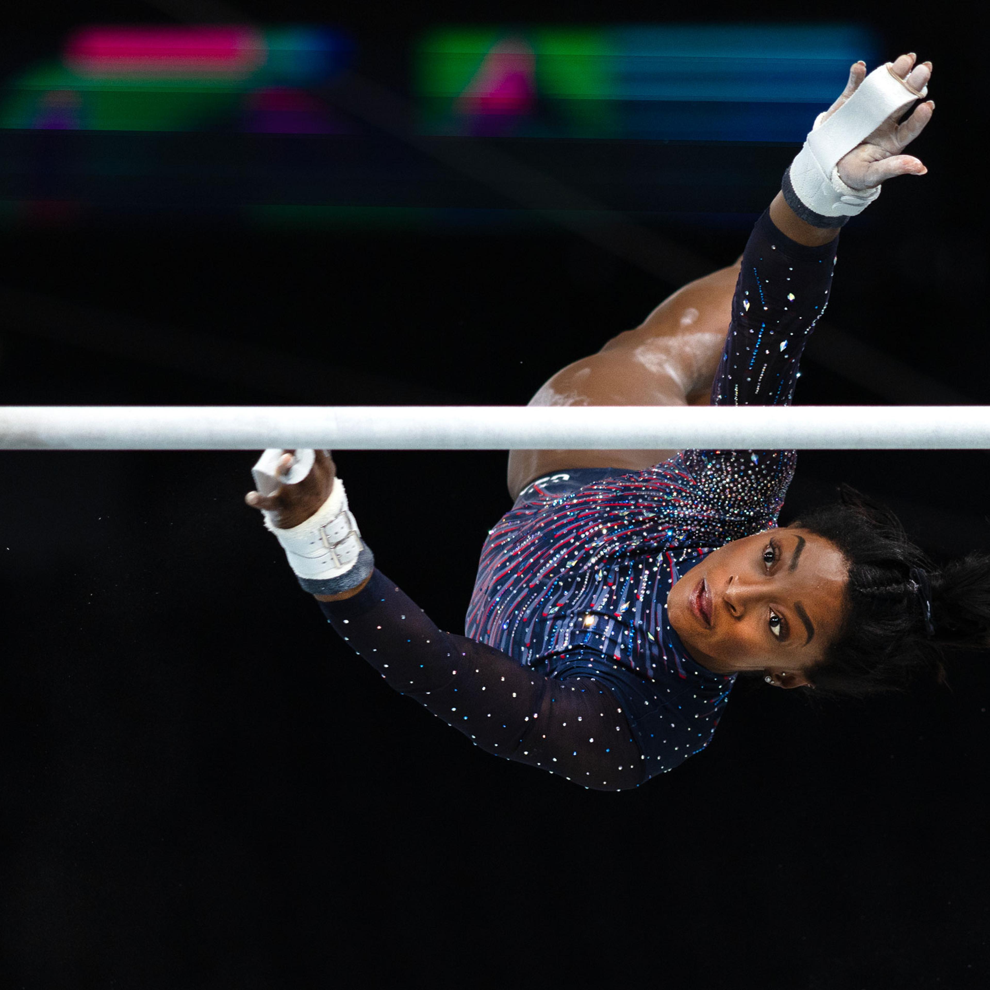 Simone Biles performs her uneven bars routine