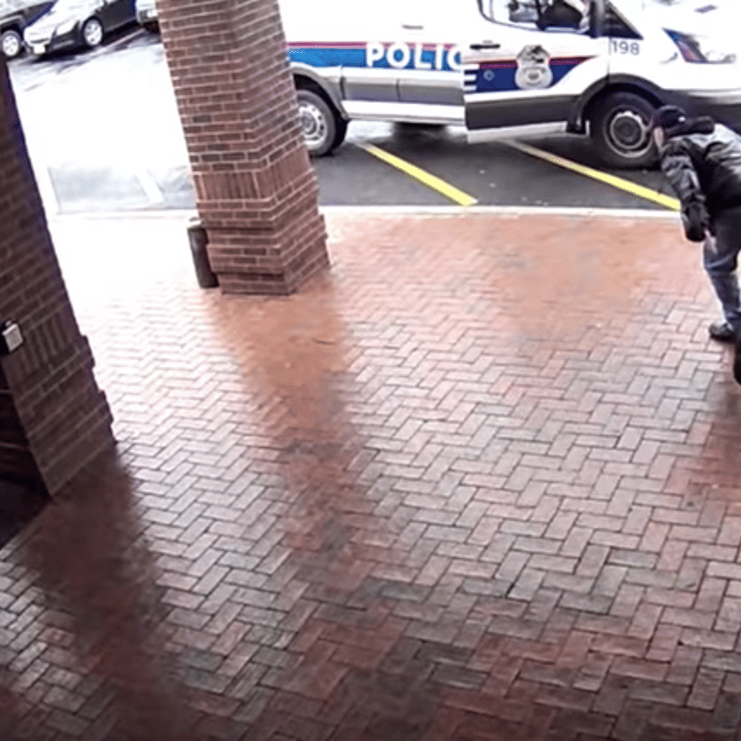Screenshot from Columbus Division of Police footage showing the moment 'Bill' tripped the 18-year-old suspect on April 3, 2018.