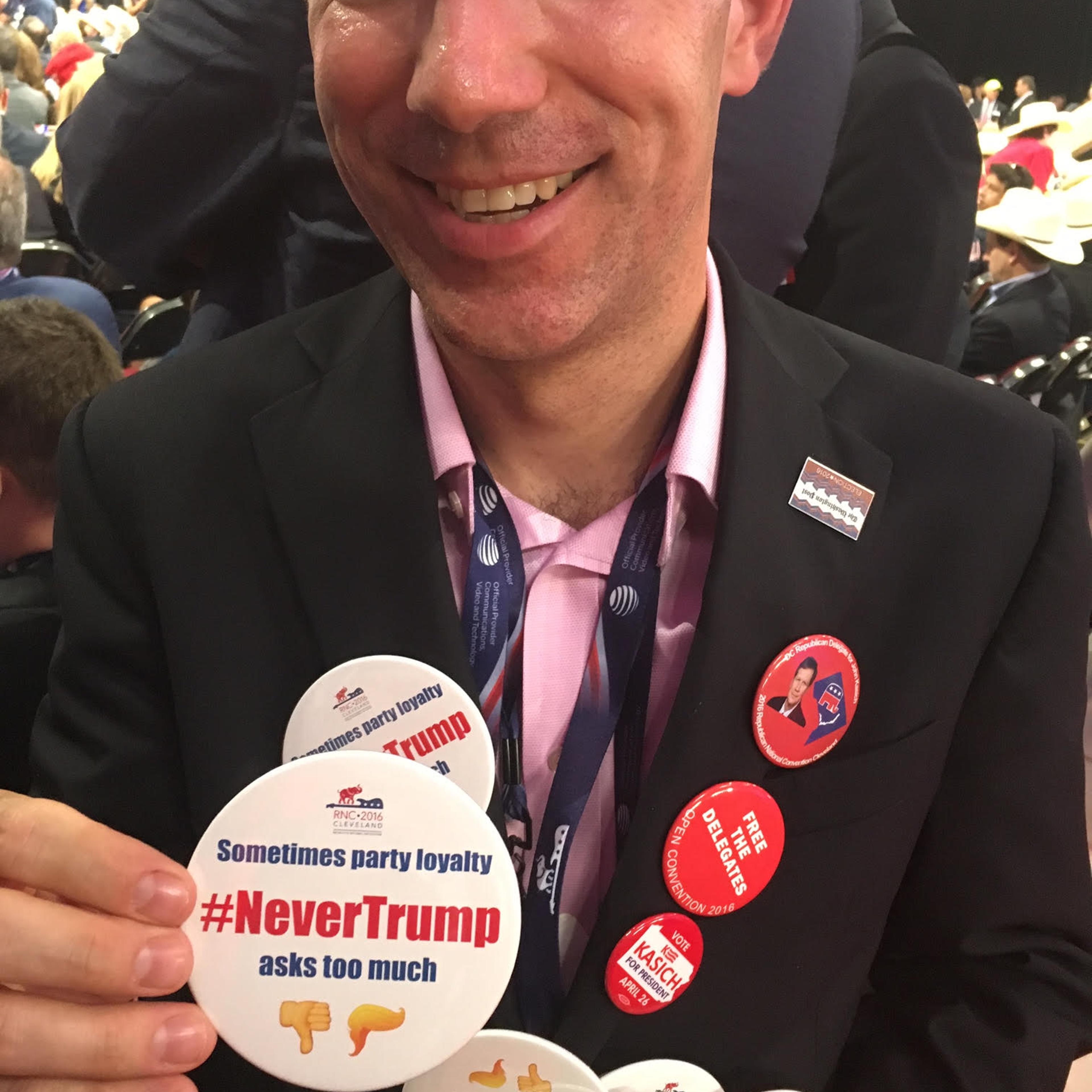 Justin Dillon, an alternate delegate from the District of Columbia is handing out 200 buttons opposing Donald Trump on the convention floor.