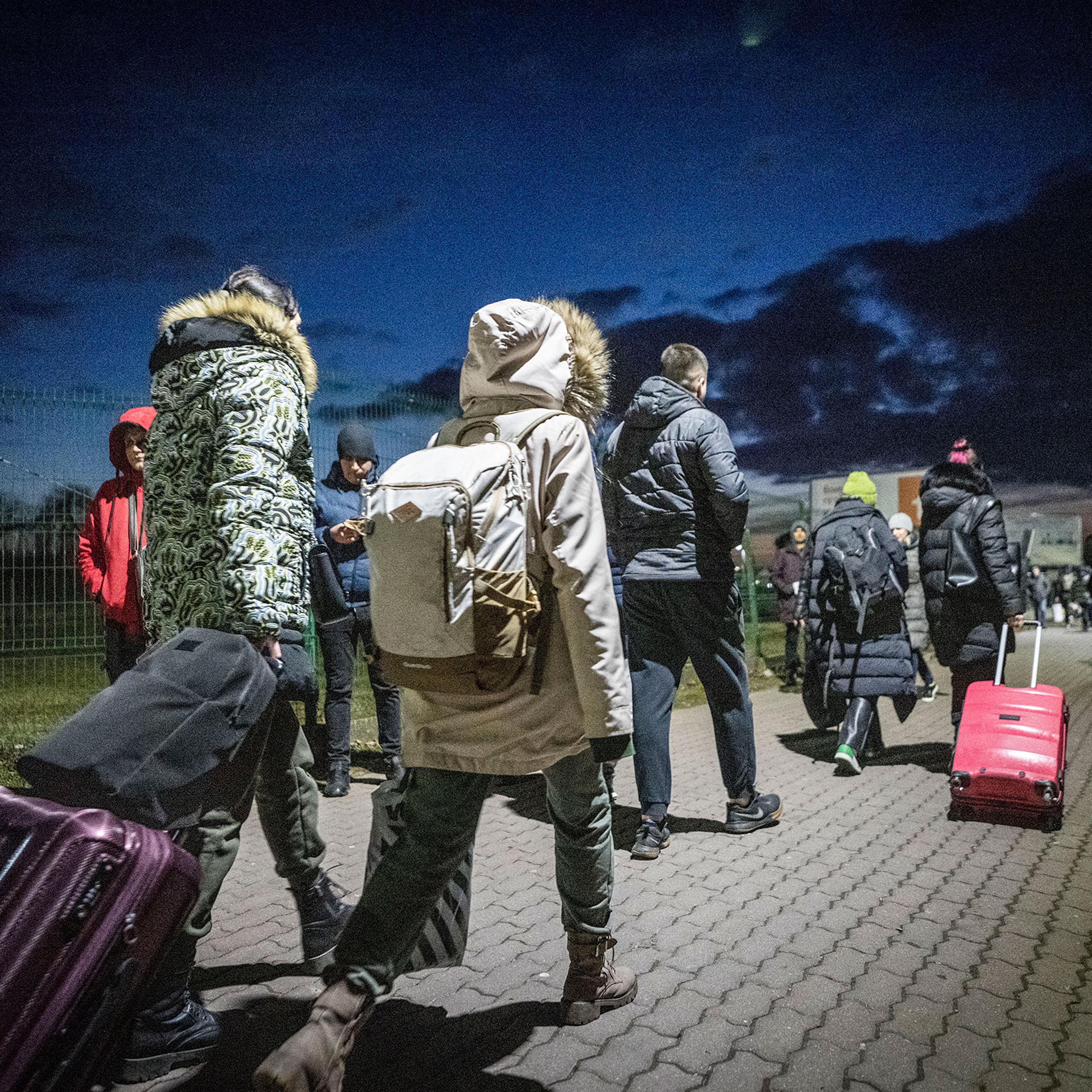 Refugees from Ukraine arrive in Medyka, Poland after crossing the border from Shehyni, Ukraine on Feb. 25, 2022.