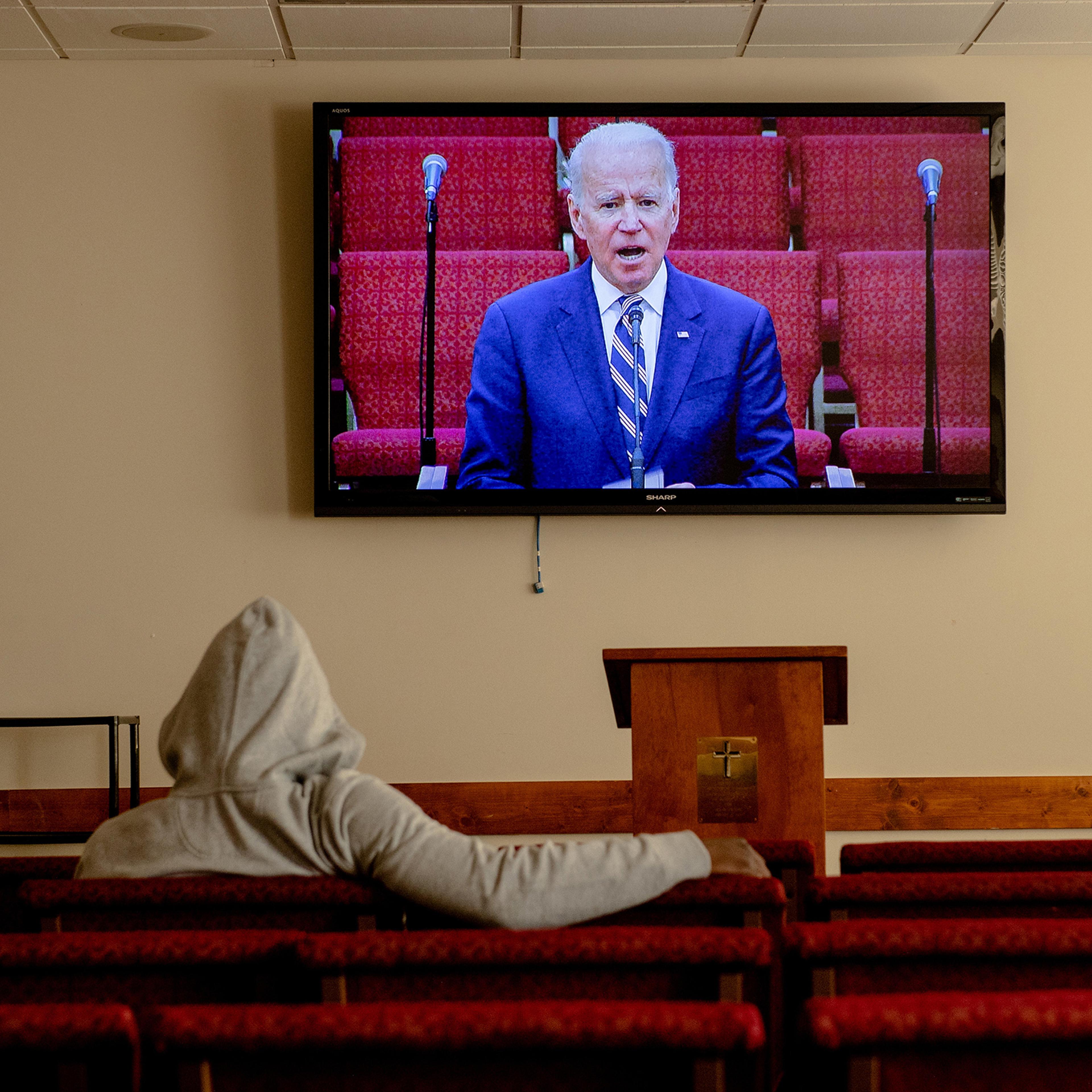 A screen shows Democratic presidential candidate Joe Biden during a service at Royal Missionary Baptist Church in North Charleston, S.C., on Feb. 23, 2020.