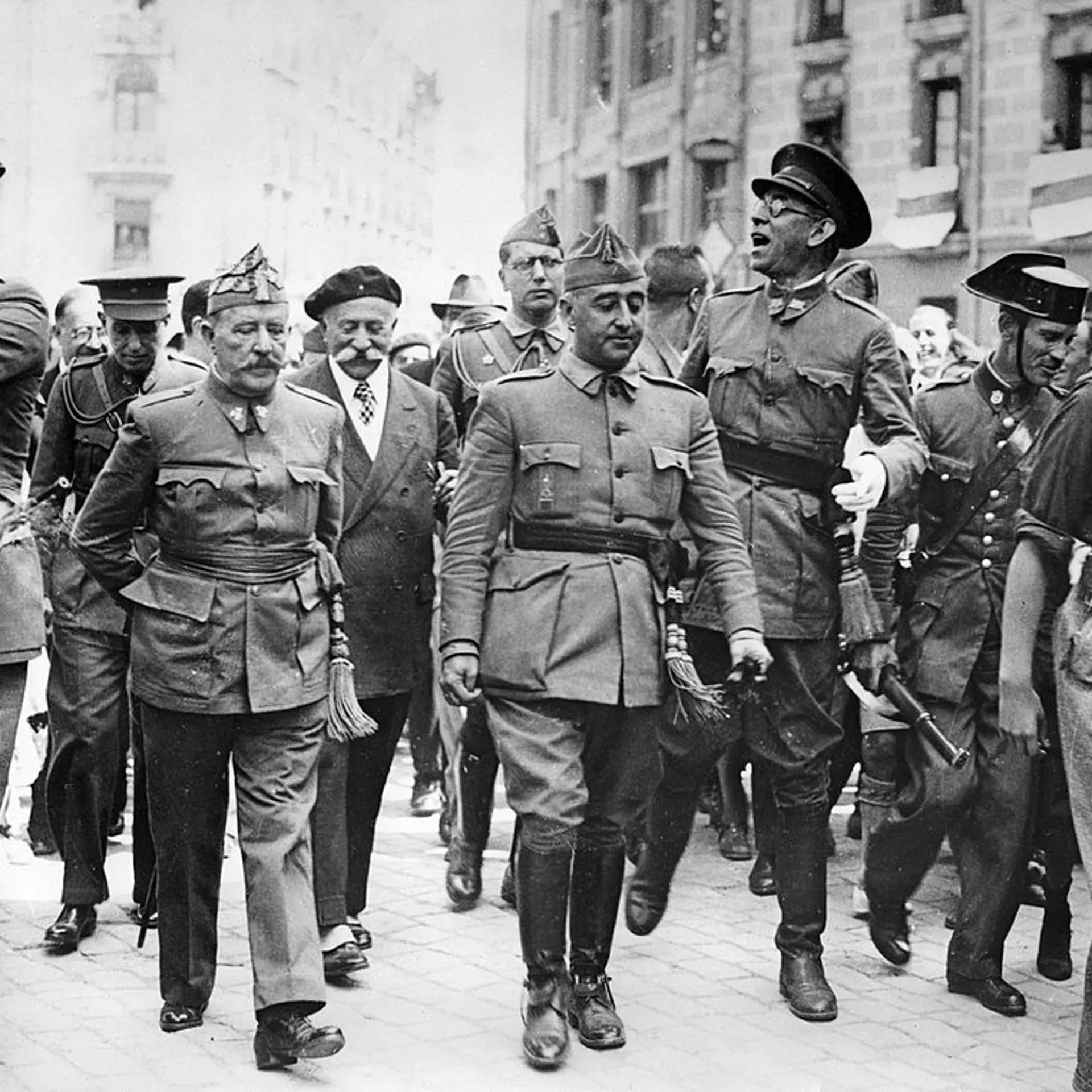 General Francisco Franco, commander in the south, is visiting the headquater of the Northern Front in Burgos. F.l.t.r.: General Cavalcanti, General Francisco Franco Bahamonde and the Nationalist commander in the north General Emilio Mola Vidal (with glas