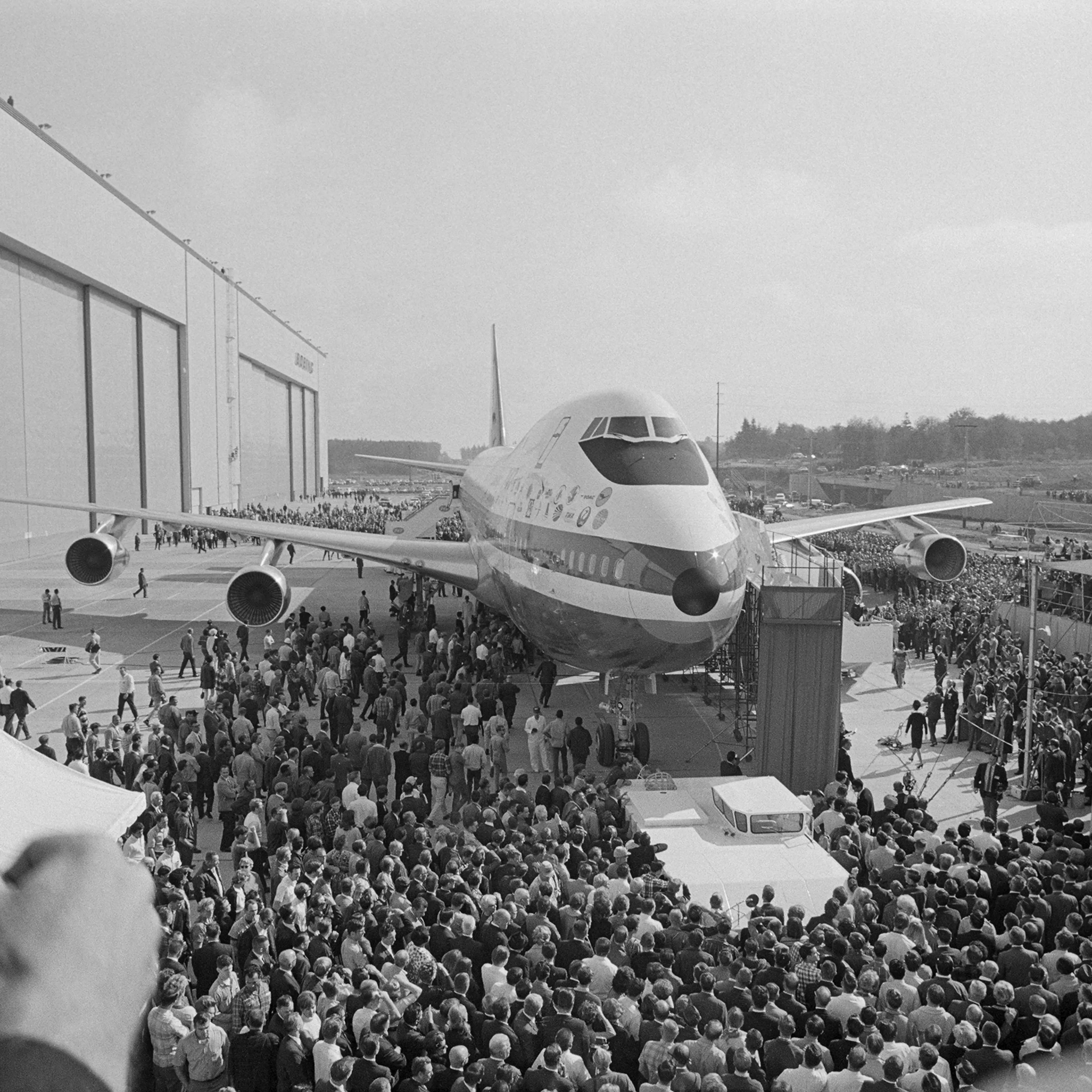 The first Boeing 747 is rolled out for public view on September 30th, 1968. Able to carry 490 passengers, the $20 million plane will be delivered to airlines starting October 1969. The craft weighs 700,000 pounds, and has 10 abreast seating and staterooms.