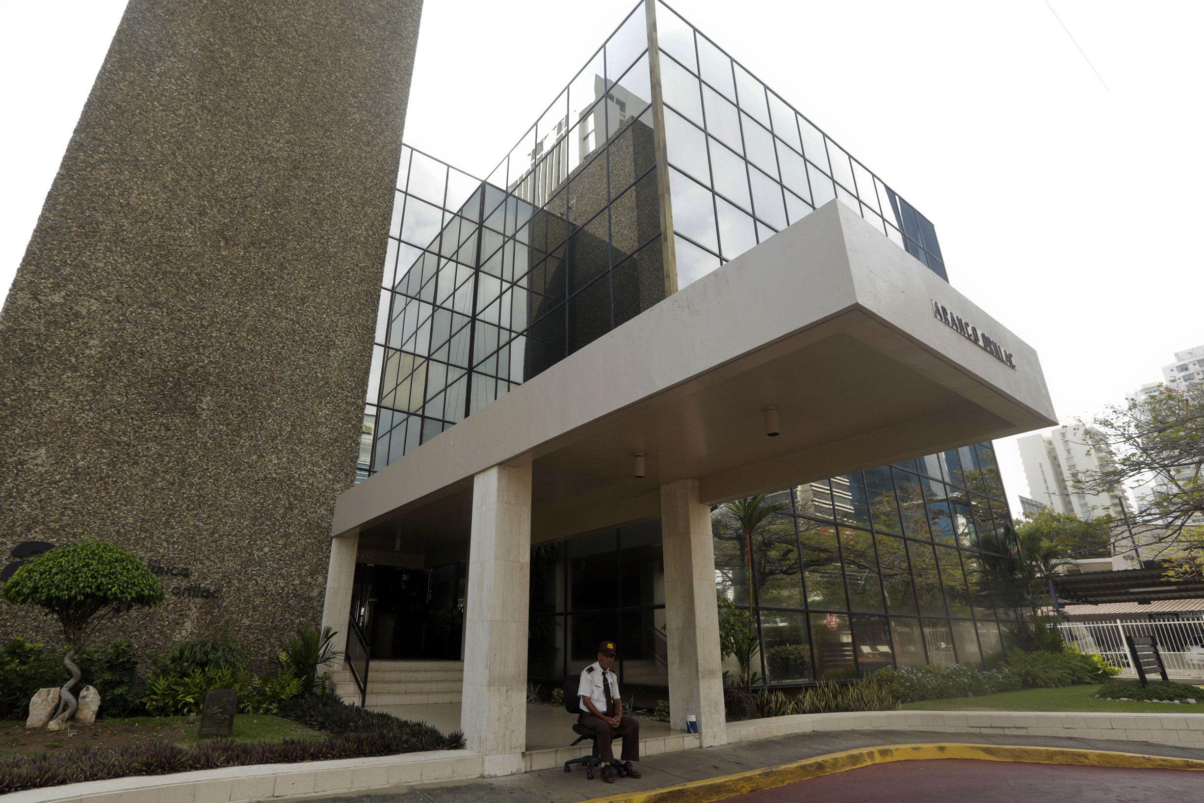 A security guard sits outside the Mossack Fonseca law firm in Panama City, Panama, on April 3, 2016.