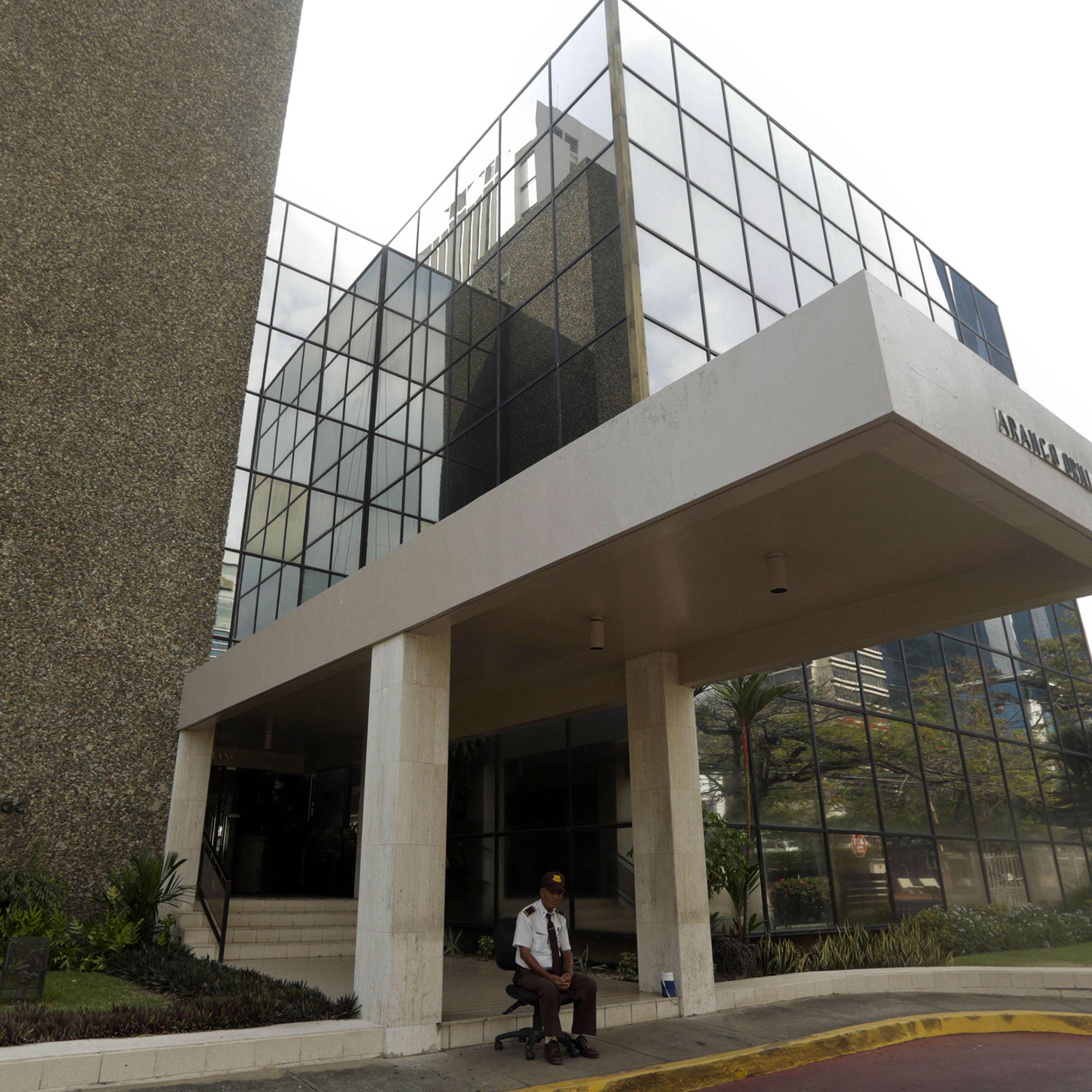 A security guard sits outside the Mossack Fonseca law firm in Panama City, Panama, on April 3, 2016.