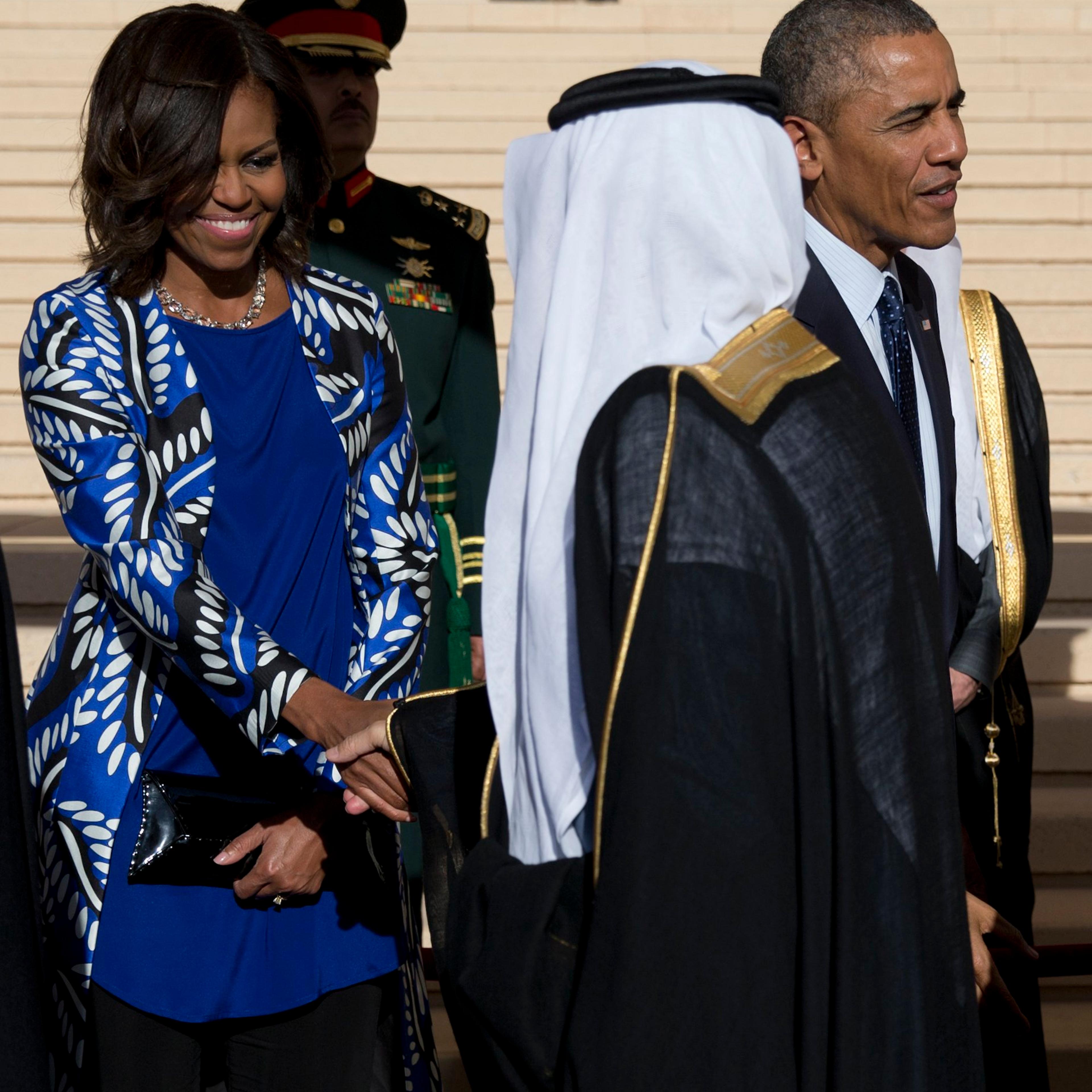 President Barack Obama and first lady Michelle Obama stand with new Saudi King Salman bin Abdul Aziz for a receiving line as they arrive at King Khalid International Airport, in Riyadh, Saudi Arabia on Jan. 27, 2015.