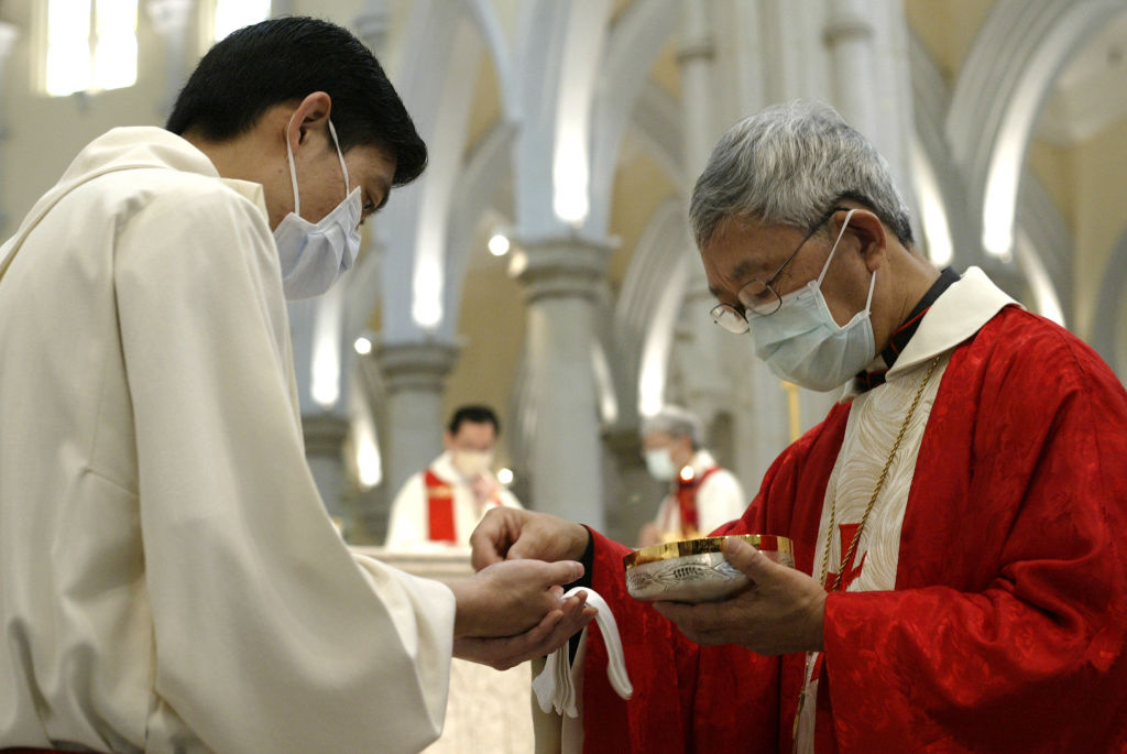 Hong Kong's Catholic Bishop Joseph Zen Ze-kiun attends a pre-Easter Mass at the Catholic Cathedral in Caine Road, Mid-Level. He urged the public to "lead themselves" out of the Sars crisis, saying the government has failed to provide relief to address th