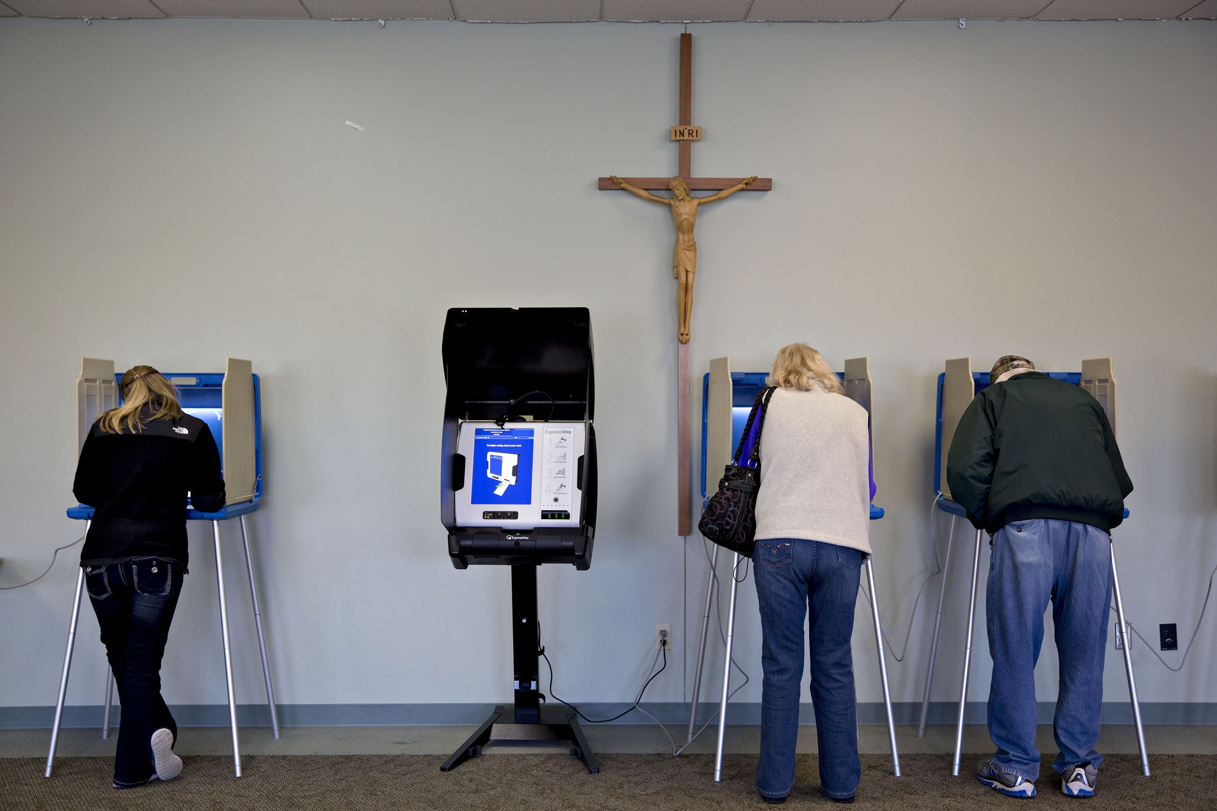 Residents fill out ballots at a polling location during the presidential primary vote in Waukesha, Wis. on April 5, 2016.