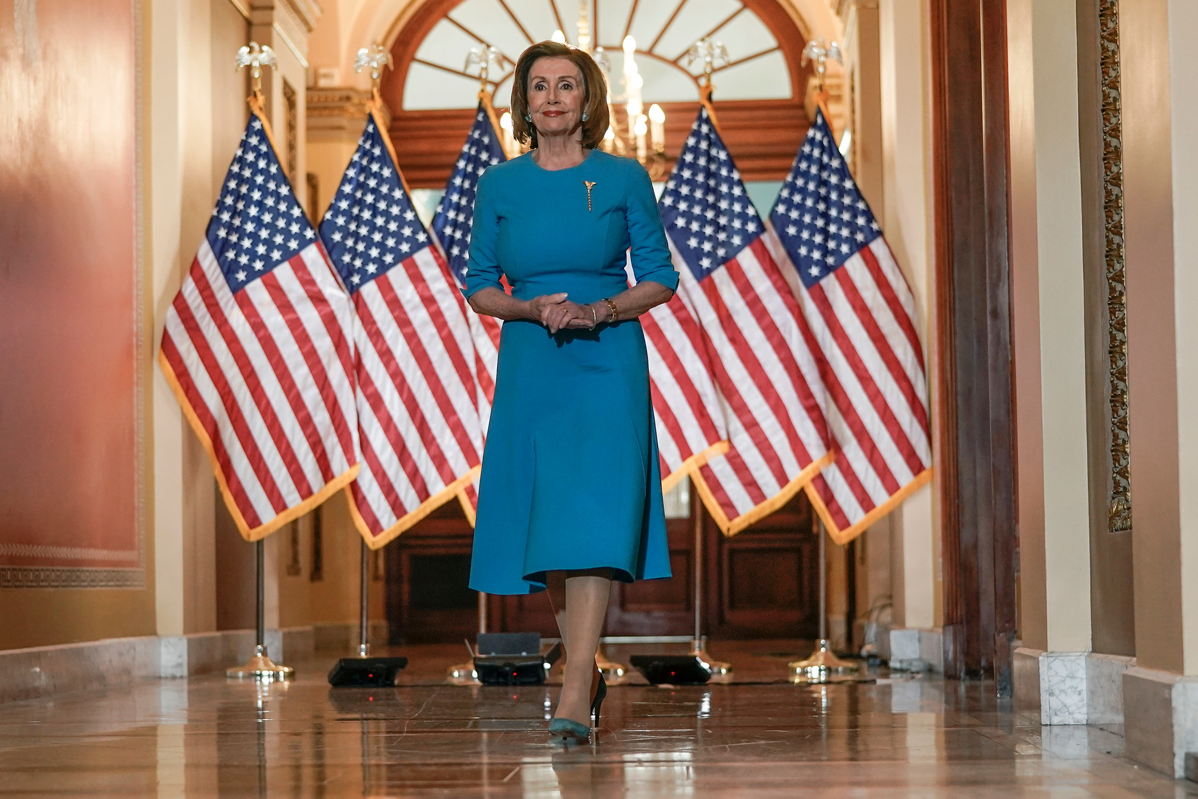 nancy pelosi wearing a short dress heels and hose Nancy Pelosi's Political Style Statements Through the Years [PHOTOS]