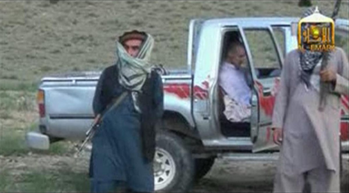 U.S. Army Sergeant Bowe Bergdahl waits in a pick-up truck before he is freed at the Afghan border