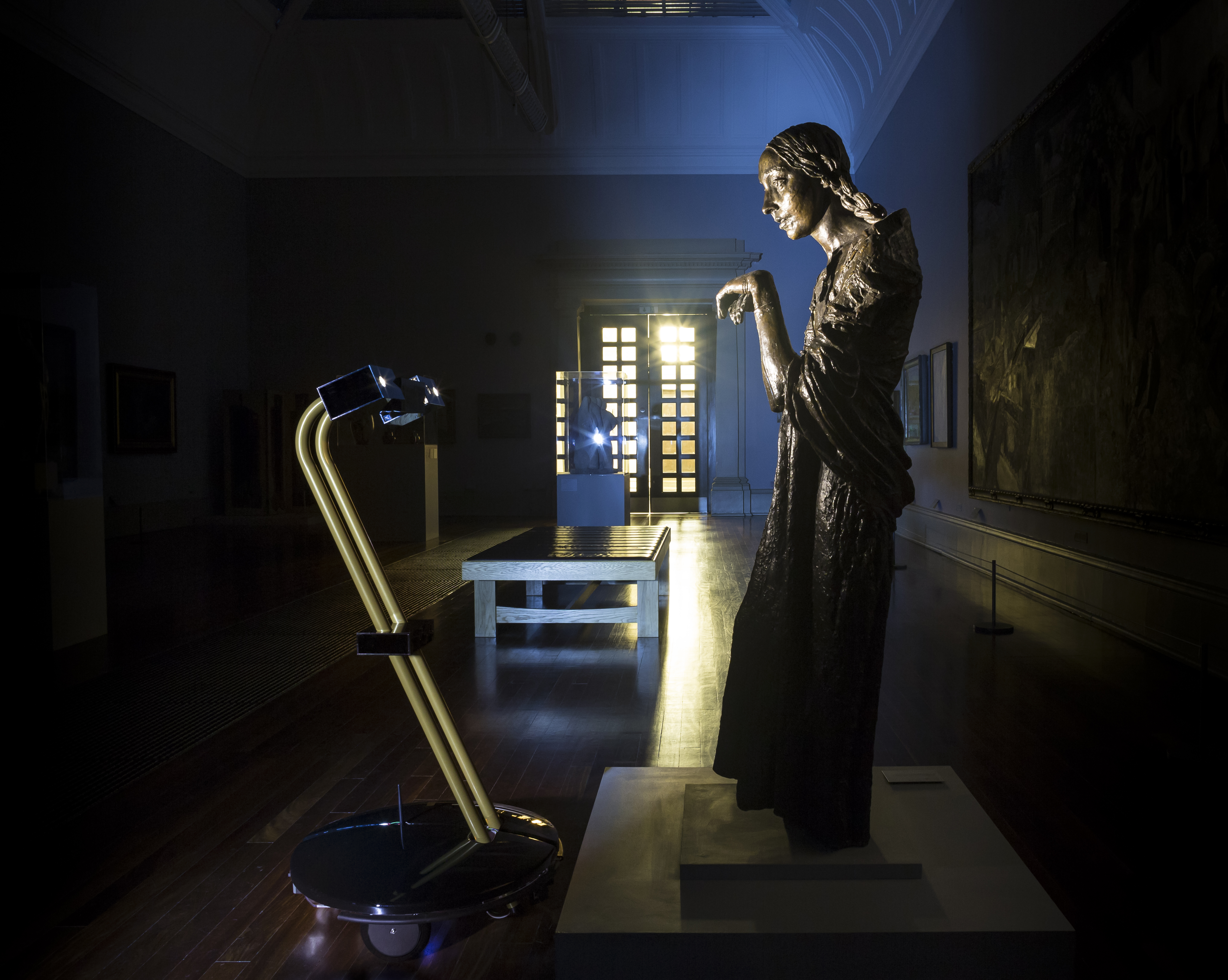 After Dark project robot with Jacob Epstein's The Visitation (1926) at Tate Britain
