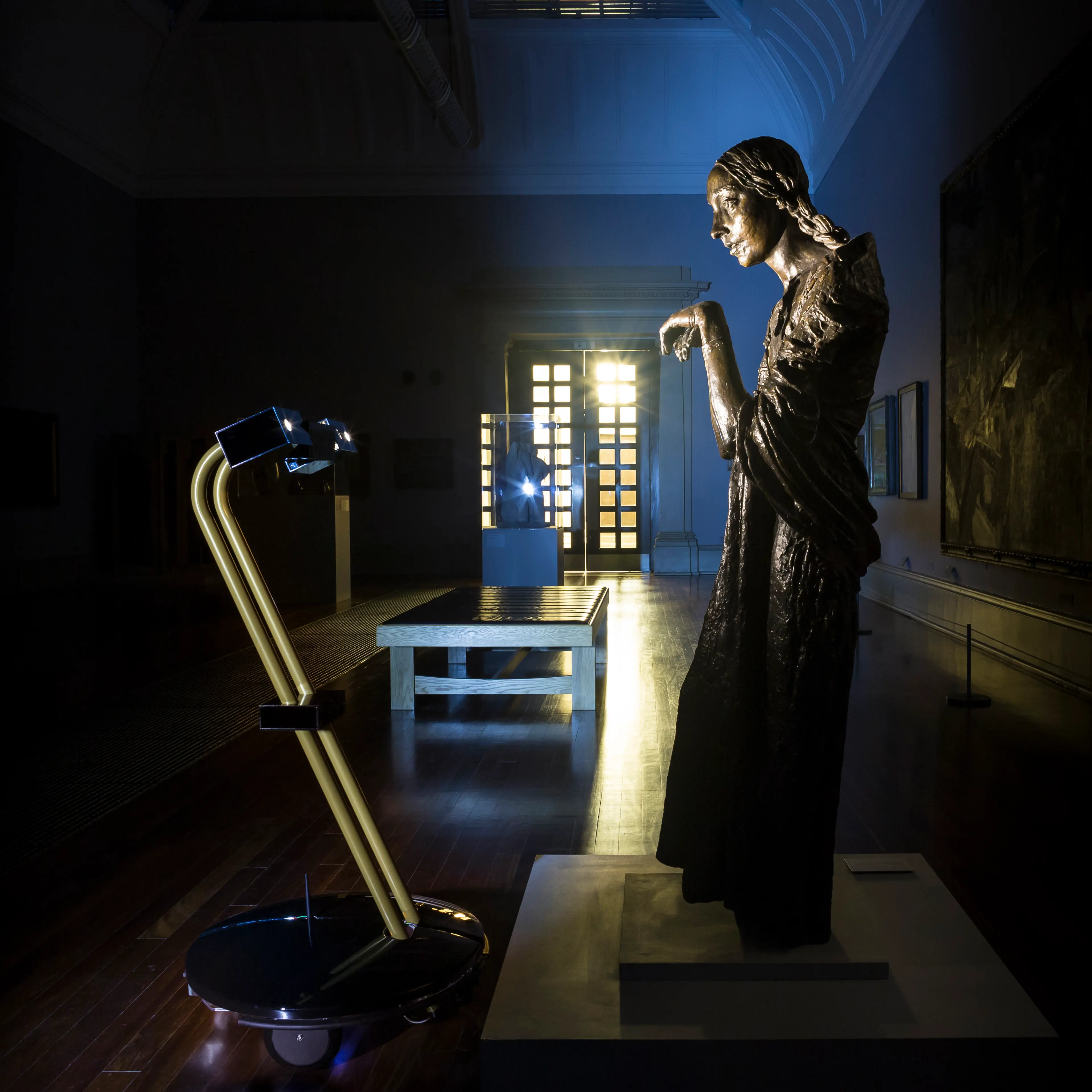 After Dark project robot with Jacob Epstein's The Visitation (1926) at Tate Britain