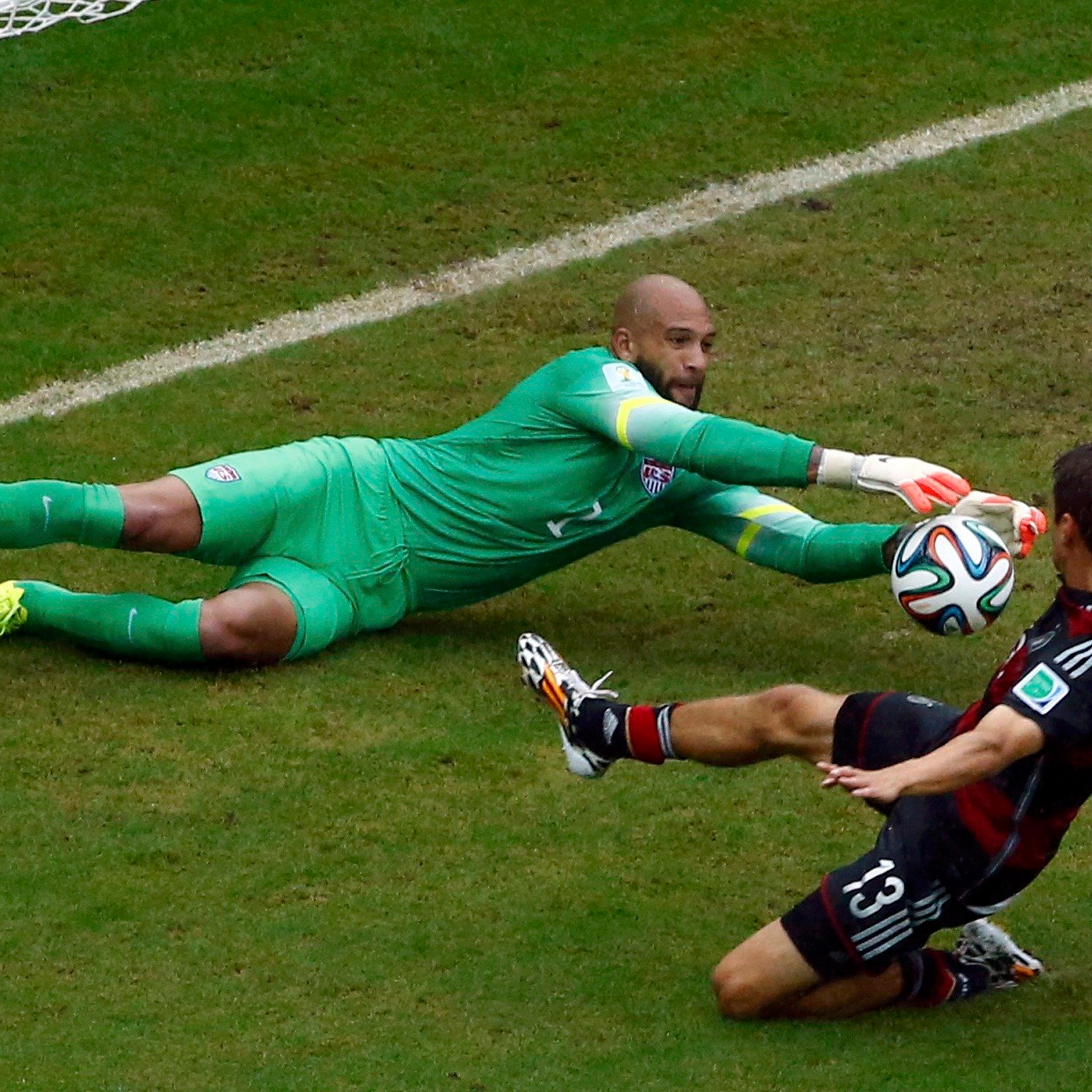 Germany's Thomas Mueller challenges goalkeeper Tim Howard of the U.S. during their 2014 World Cup Group G soccer match at the Pernambuco arena in Recife, Brazil on June 26, 2014.