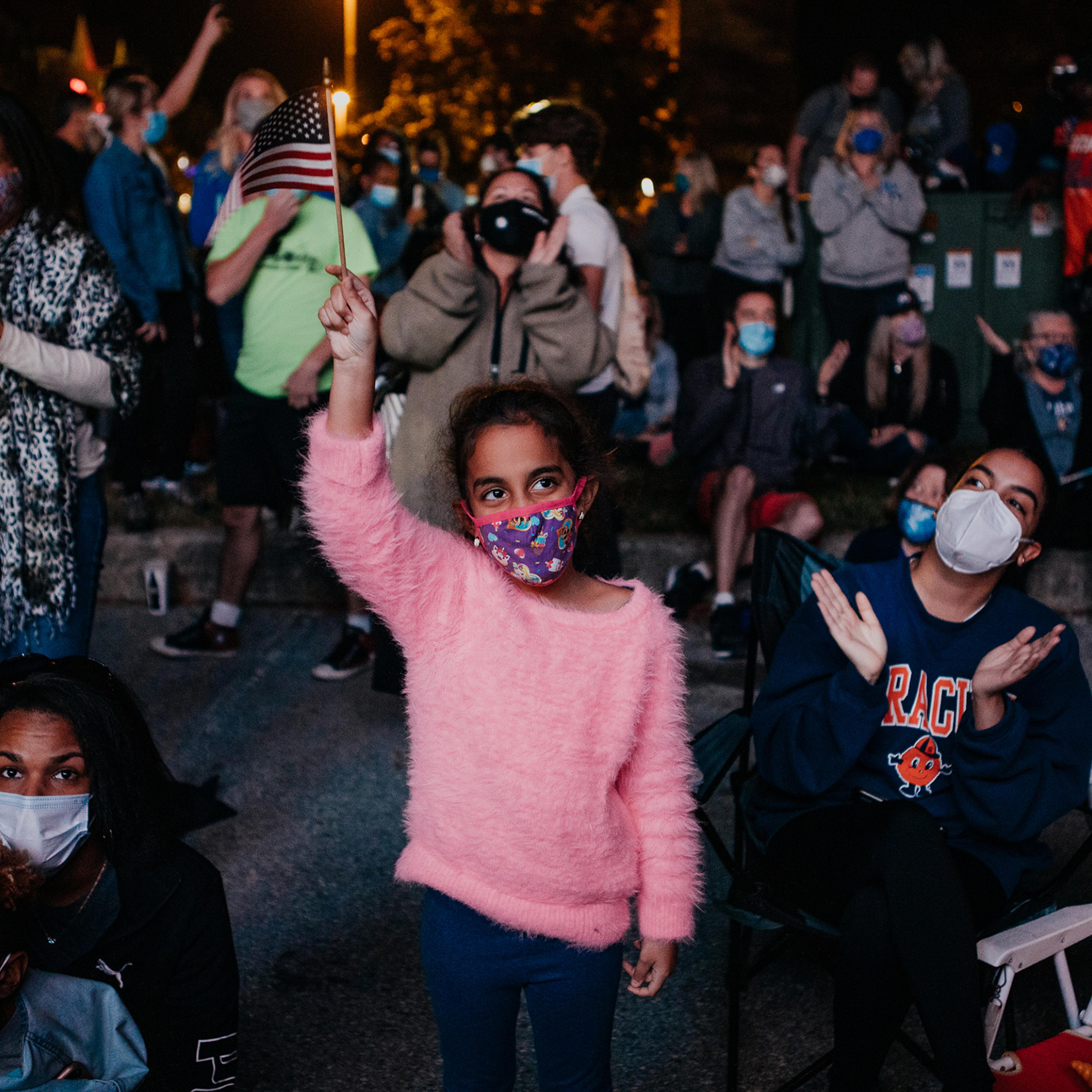 Mia Duran, 6, of Claymont, Del., outside the Chase Center in Wilmington on Nov. 7, 2020. President-elect Joe Biden and Vice President-elect Kamala Harris delivered their victory speeches there that evening.