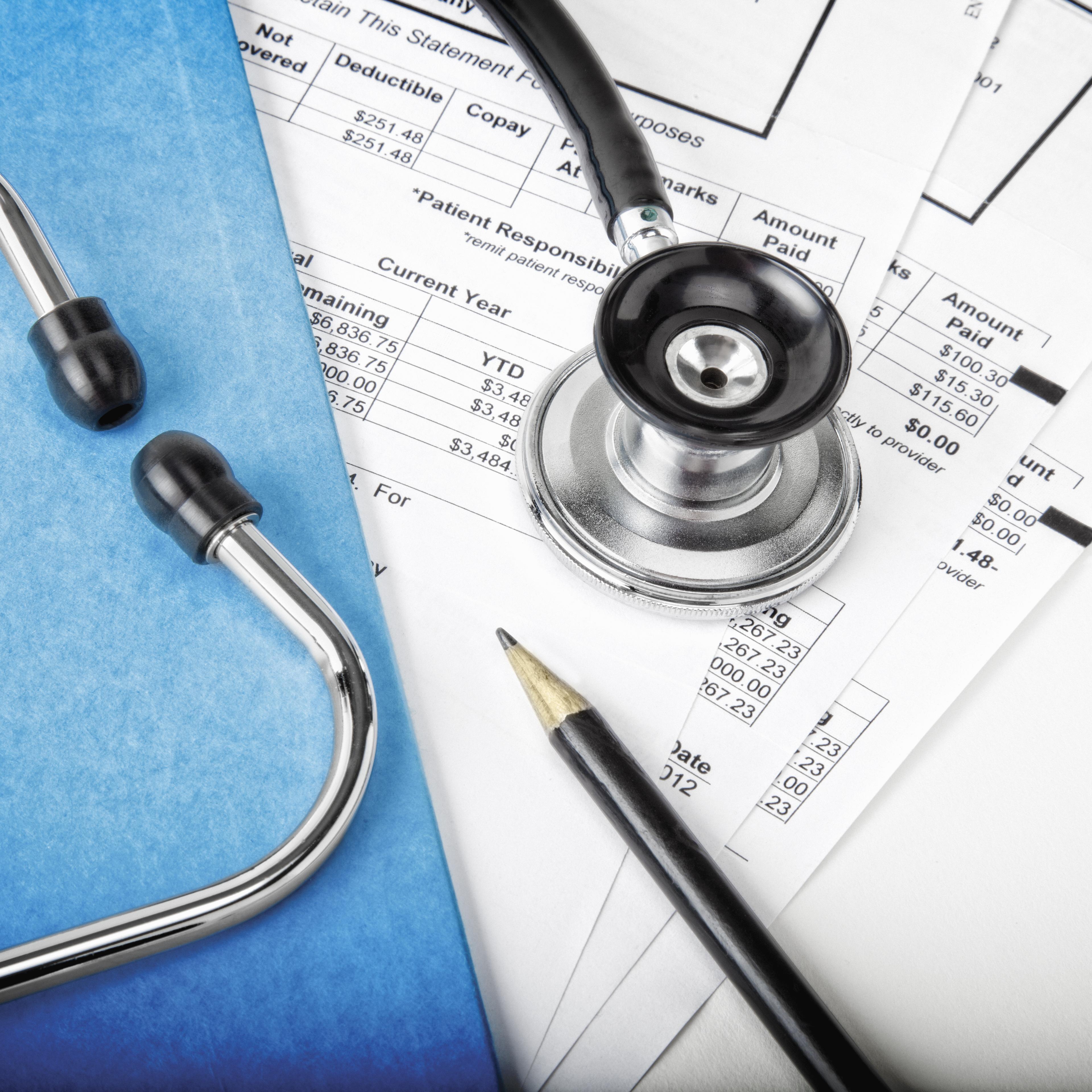 Medical bills with stethoscope