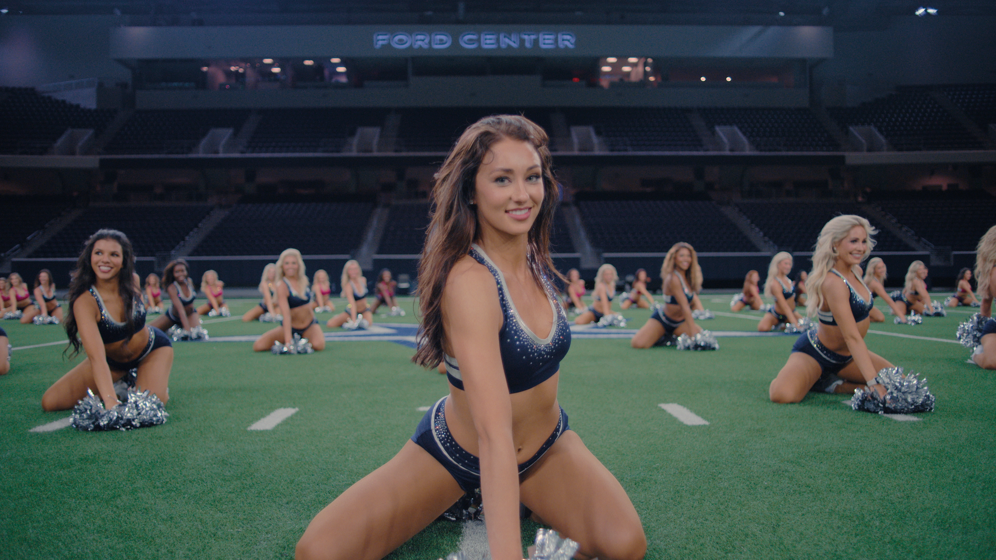 Kelcey leads a cheer in <i>America's Sweethearts</i>