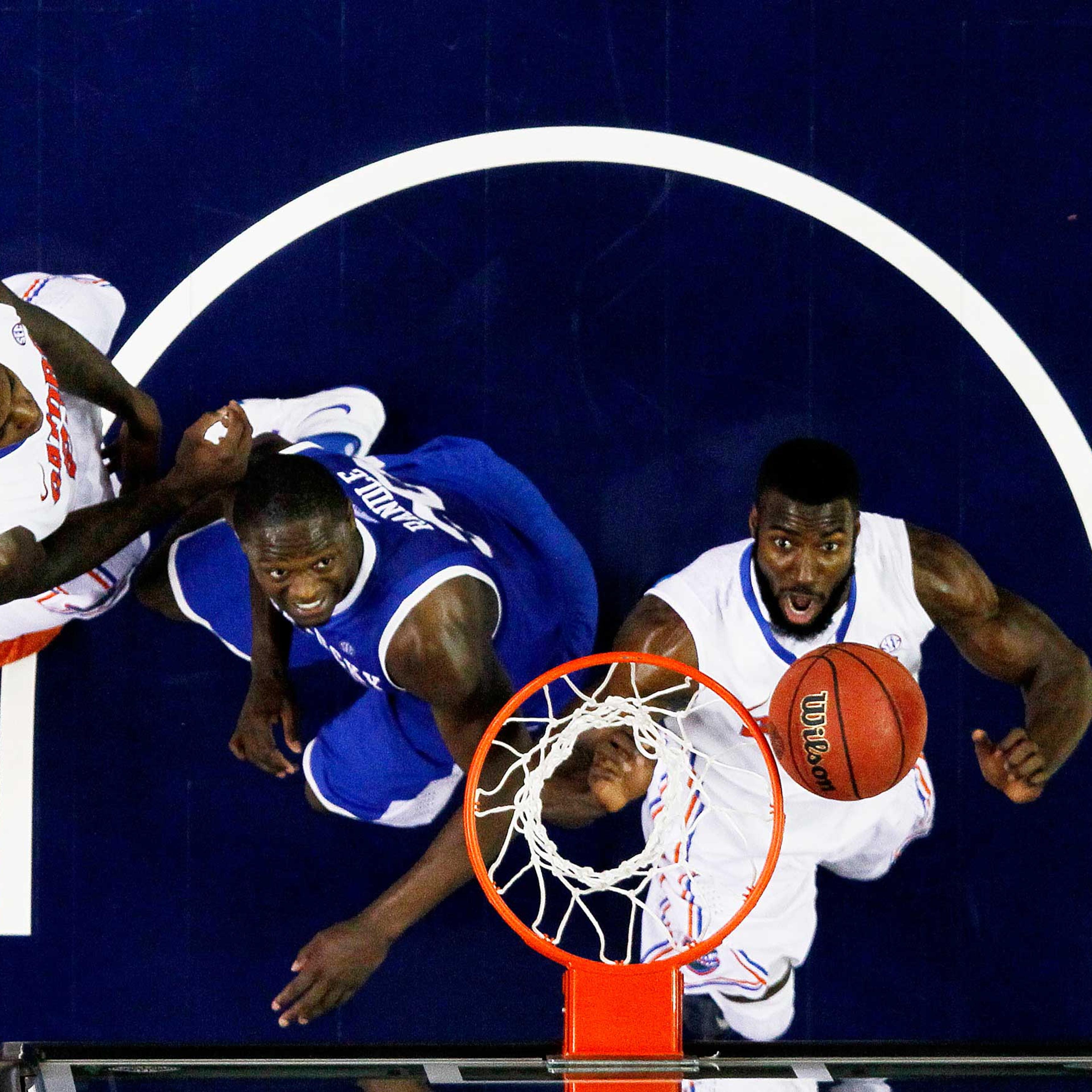 Patric Young #4 of the Florida Gators and Julius Randle #30 of the Kentucky Wildcats vie for a rebound in the second half during the Championship game of the 2014 Men's SEC Basketball Tournament at Georgia Dome on March 16, 2014 in Atlanta, Georgia.