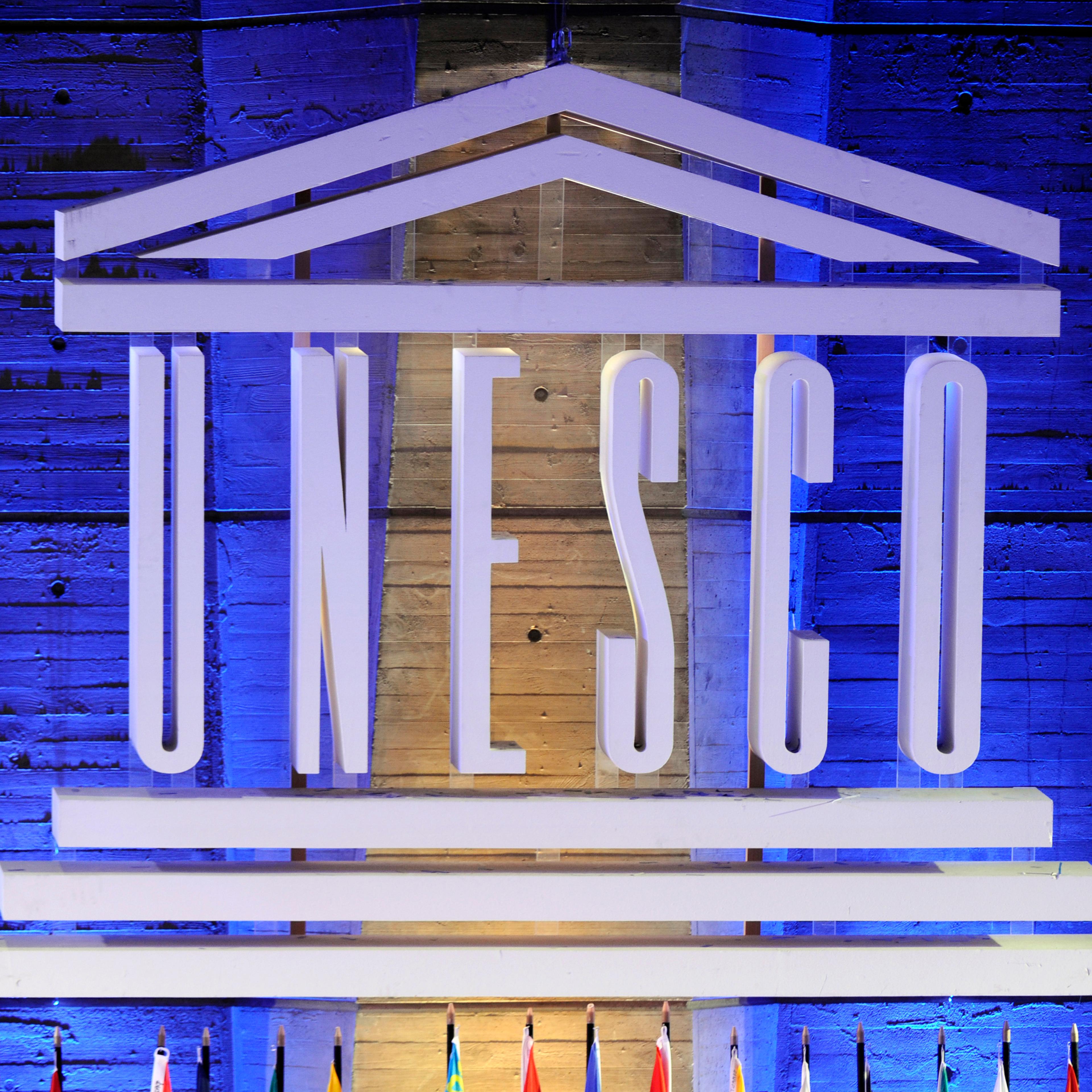 A logo of the United Nations Educational, Scientific and Cultural Organization (UNESCO) is displayed in front of the organization headquarters on September 14, 2011.