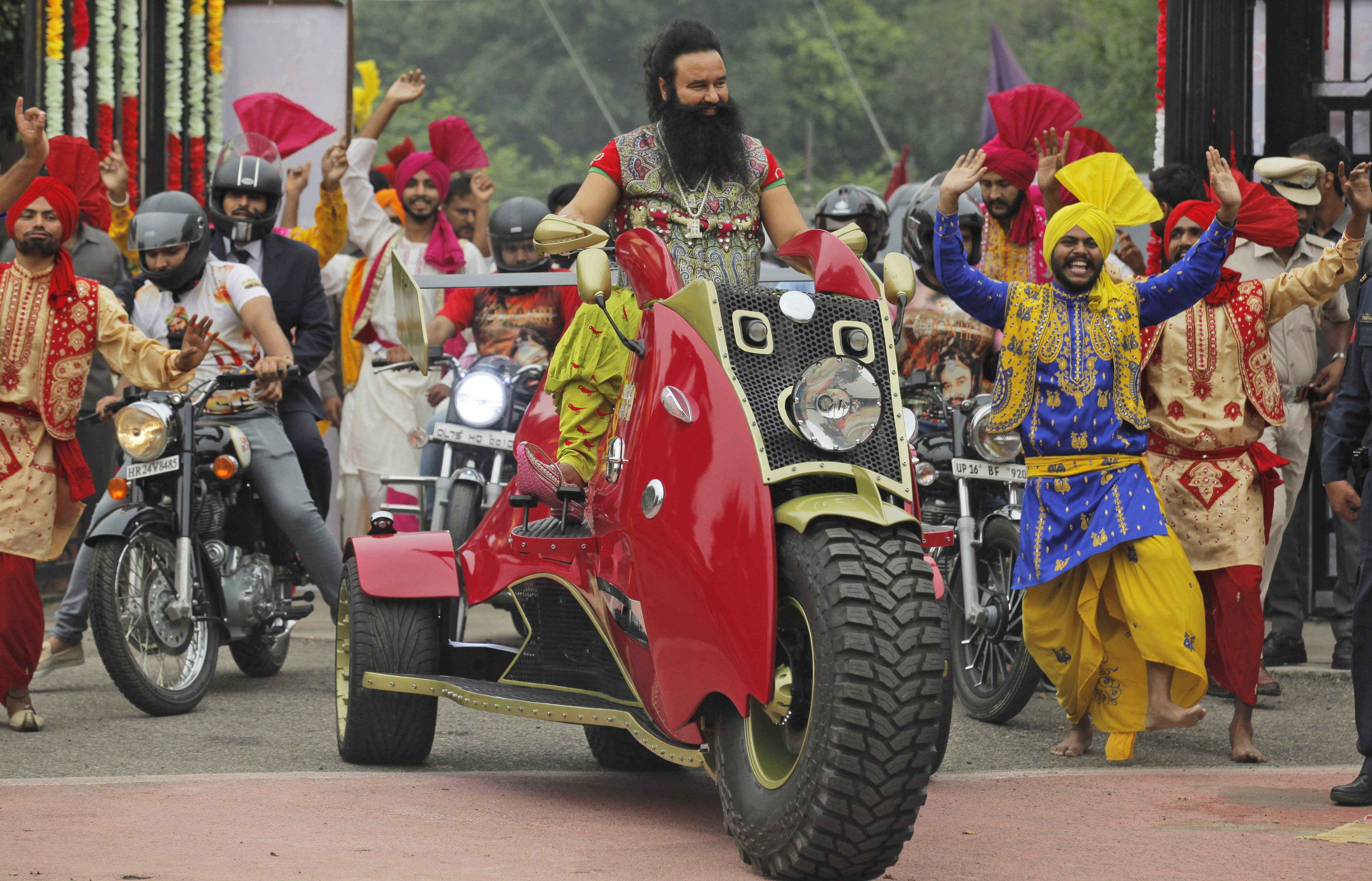 Indian spiritual guru, who calls himself Saint Dr. Gurmeet Ram Rahim Singh Ji Insan, arrives for a press conference ahead of the release of his new film "MSG, The Warrior Lion Heart," in New Delhi, Oct. 5, 2016.