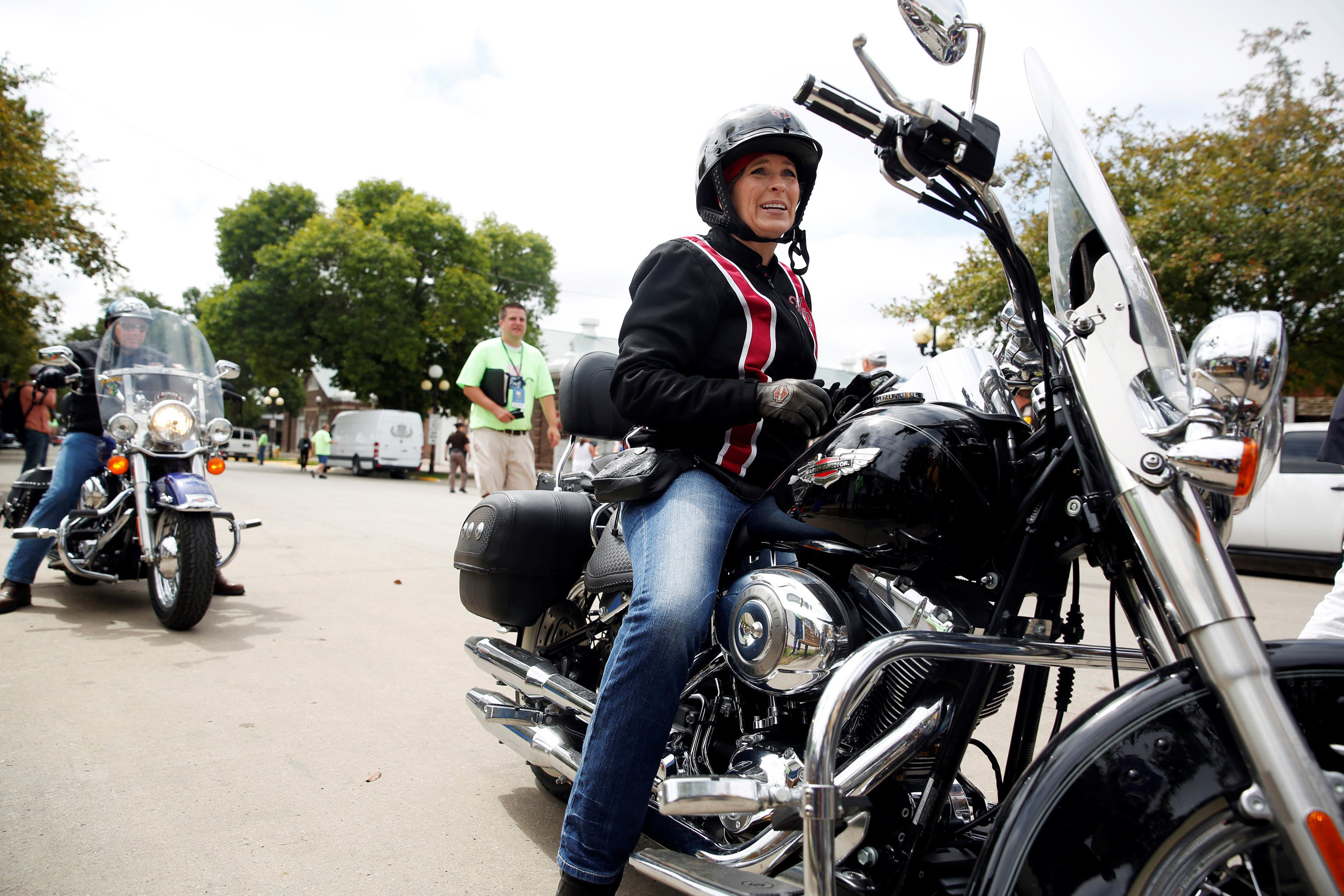 Iowa Senator Joni Ernst arrives via motorcycle to her annual Roast and Ride at the Iowa State Fairgrounds in Des Moines Aug. 27, 2016.