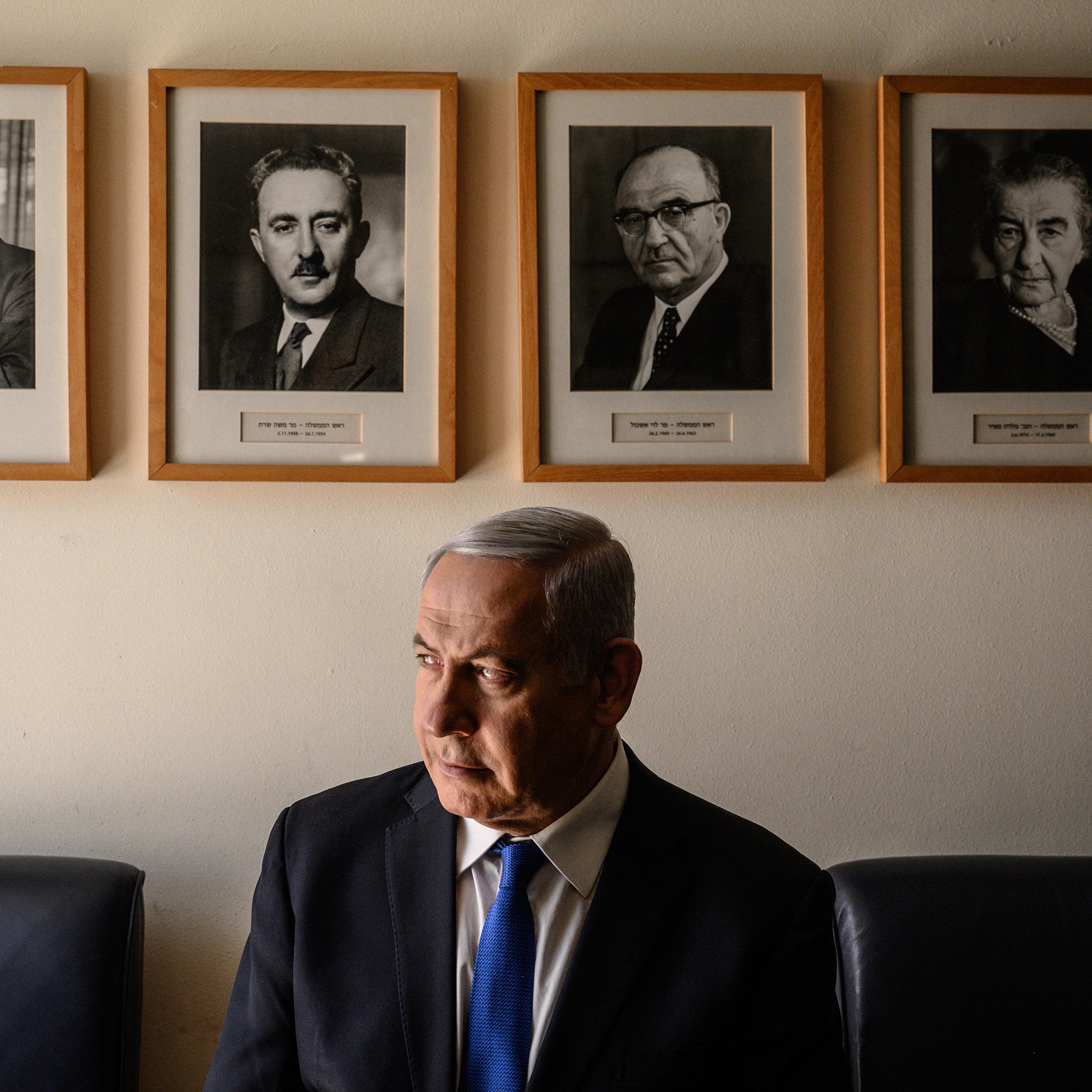 Netanyahu in his Jerusalem office, with portraits of Israel’s early Prime Ministers, starting with David Ben-Gurion, top left.