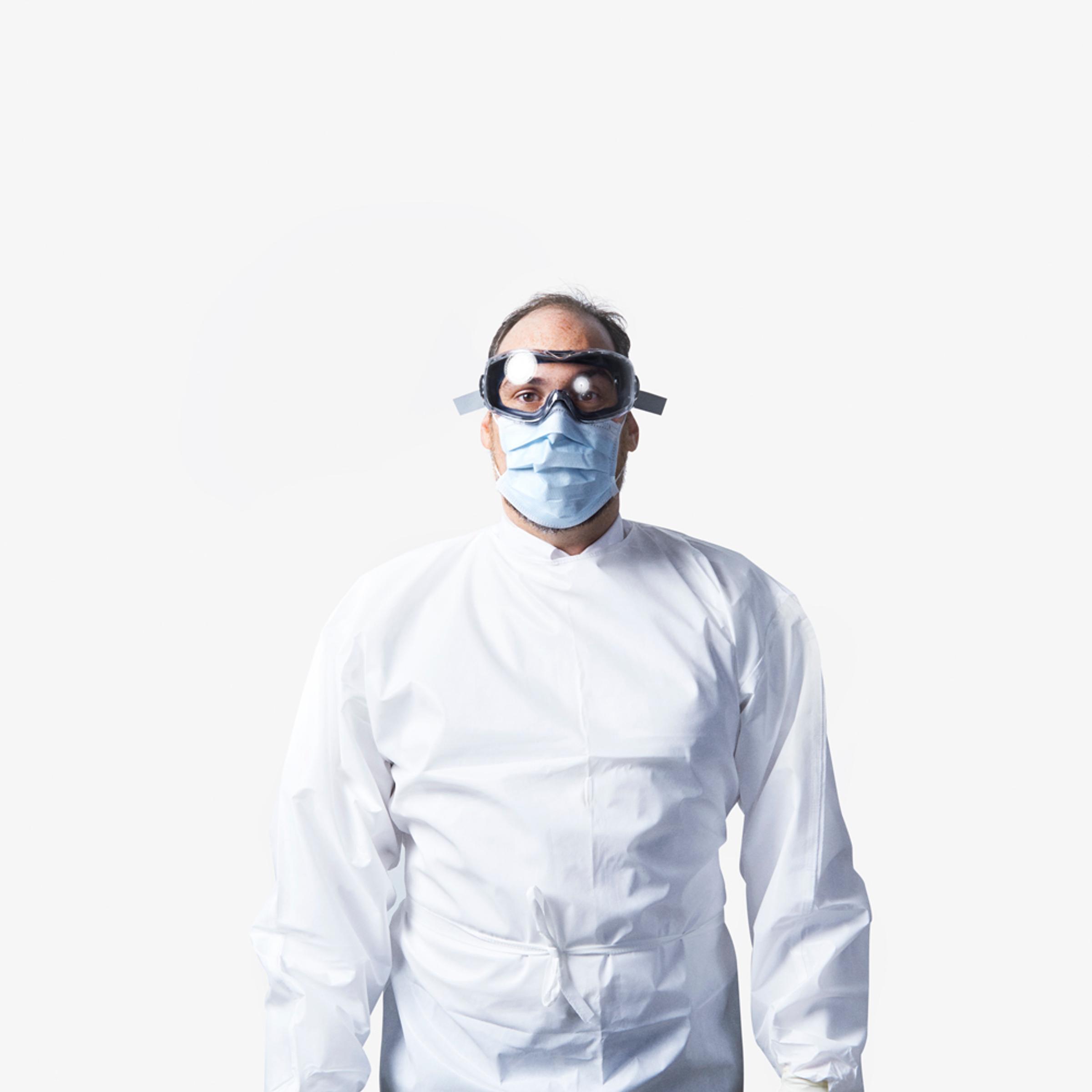 Dr. David Kuhar of the CDC wears the protective suiting needed to prevent Ebola infections at hospitals